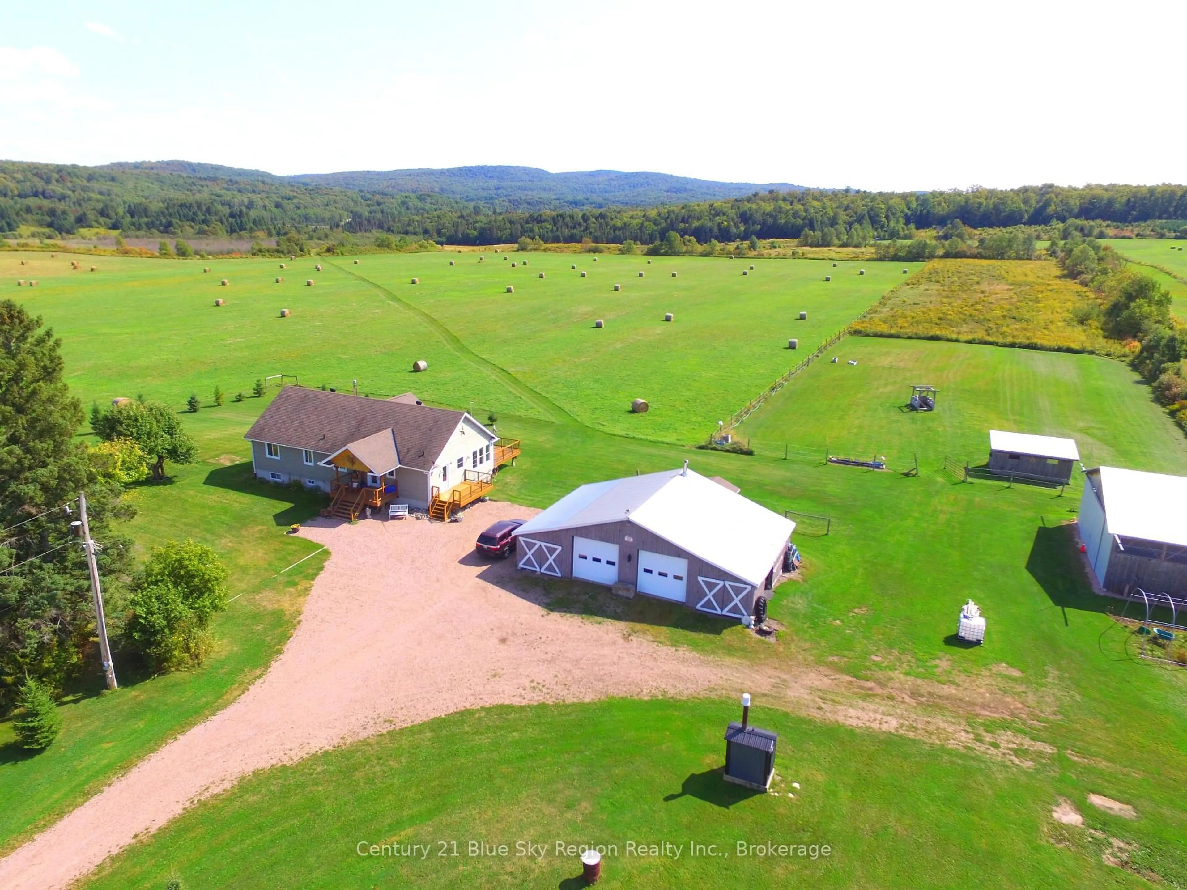 A pic from outside/outdoor area/front of a property/back of a property/a pic from drone, mountain view for 167 English Line, Powassan Ontario P0H 1Z0