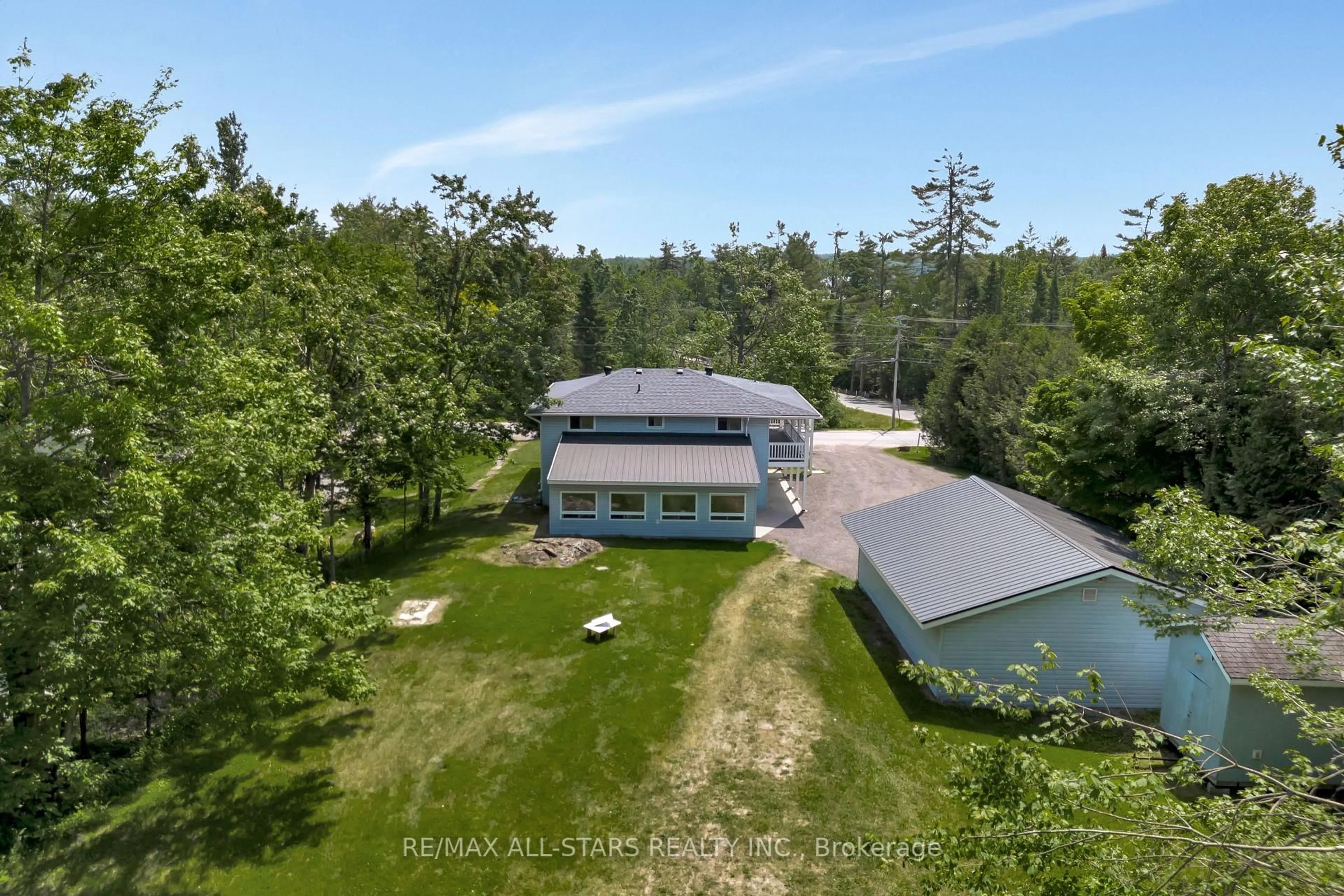 A pic from outside/outdoor area/front of a property/back of a property/a pic from drone, unknown for 394 Kennedy Dr, Trent Lakes Ontario K0M 1A0