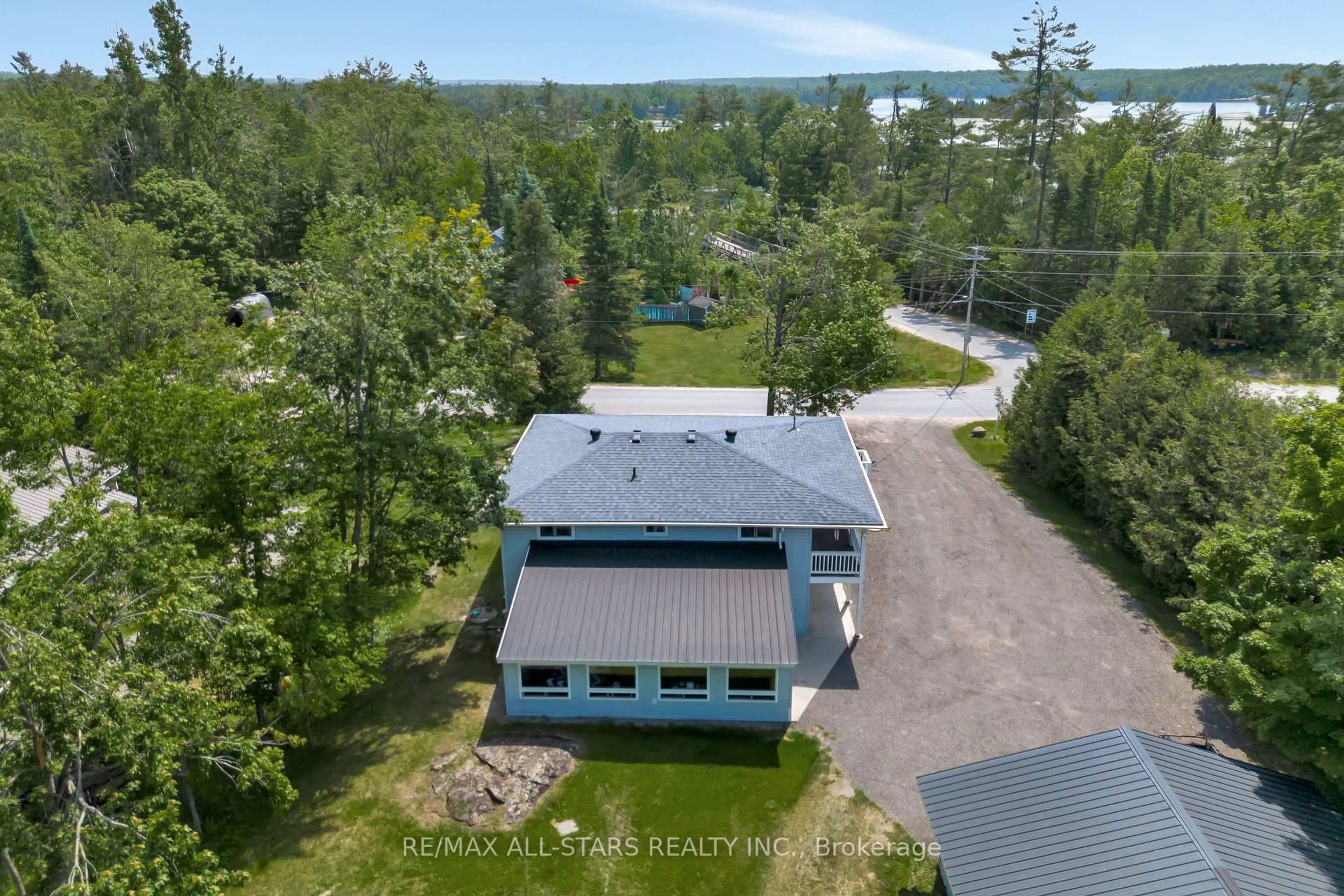 A pic from outside/outdoor area/front of a property/back of a property/a pic from drone, unknown for 394 Kennedy Dr, Trent Lakes Ontario K0M 1A0