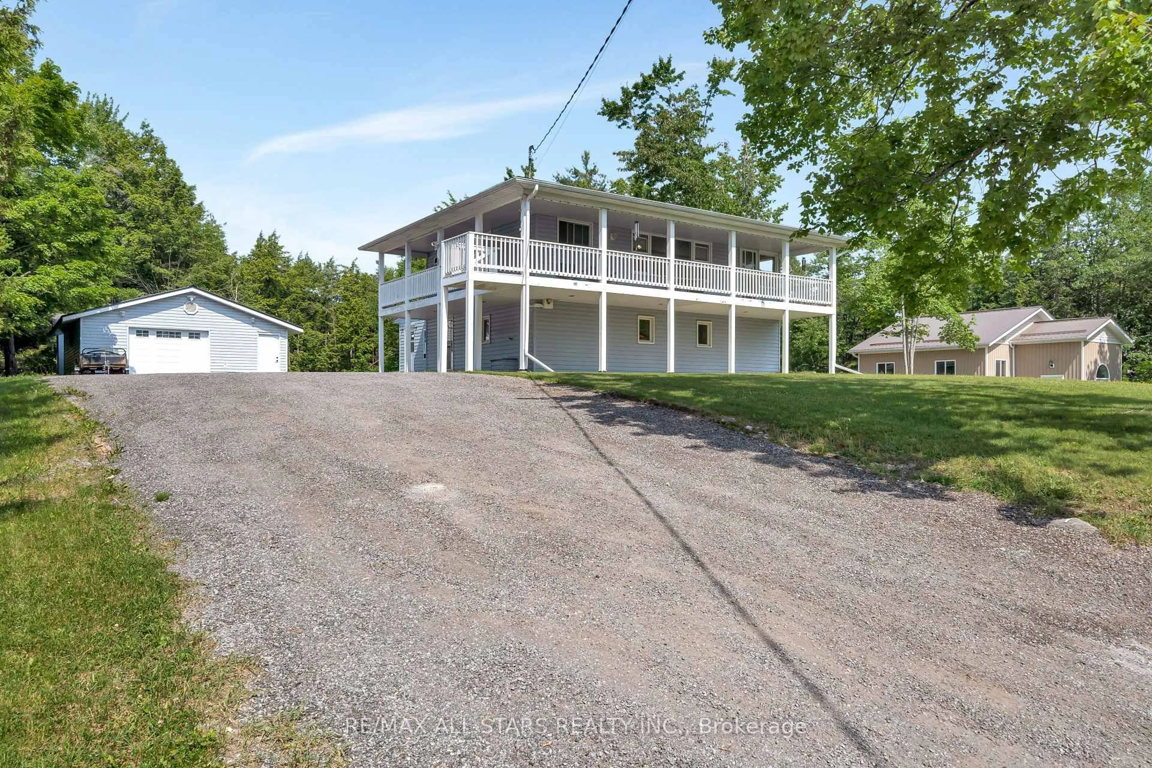 A pic from outside/outdoor area/front of a property/back of a property/a pic from drone, unknown for 394 Kennedy Dr, Trent Lakes Ontario K0M 1A0