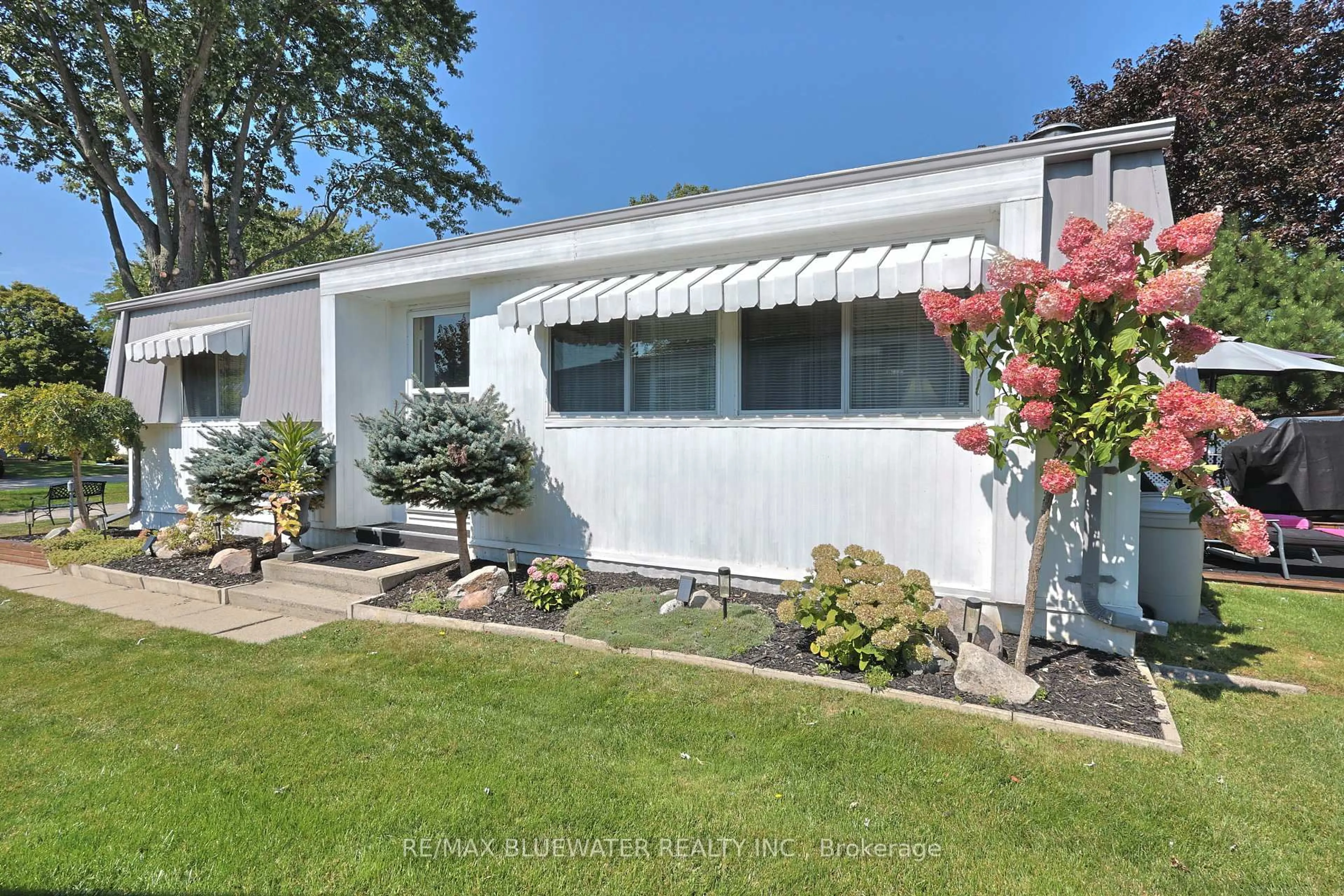 Home with vinyl exterior material, street for 208 Biltmore Dr, South Huron Ontario N0M 1T0