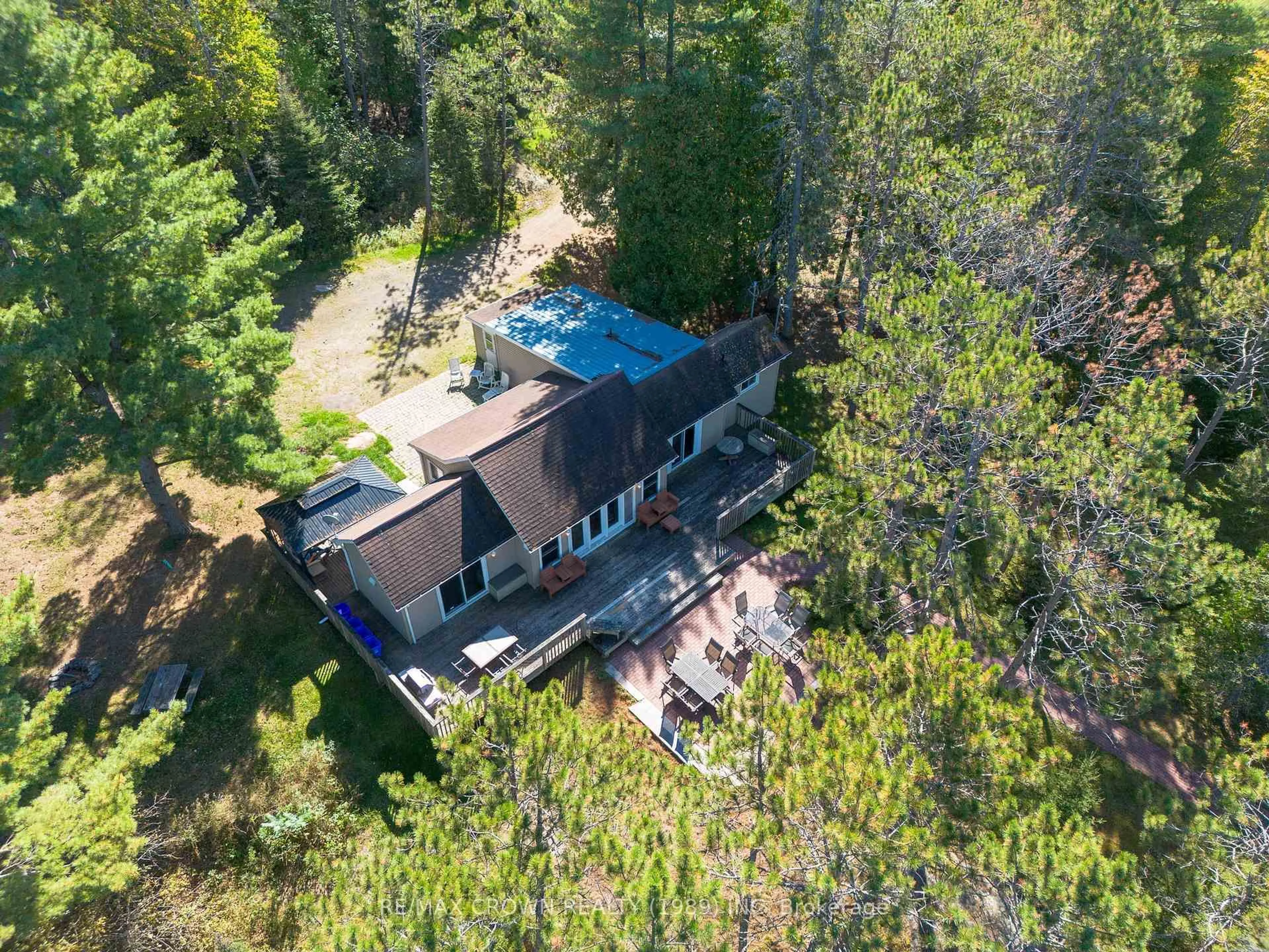 A pic from outside/outdoor area/front of a property/back of a property/a pic from drone, forest/trees view for 260 Birchgrove Dr, Callander Ontario P0H 1H0