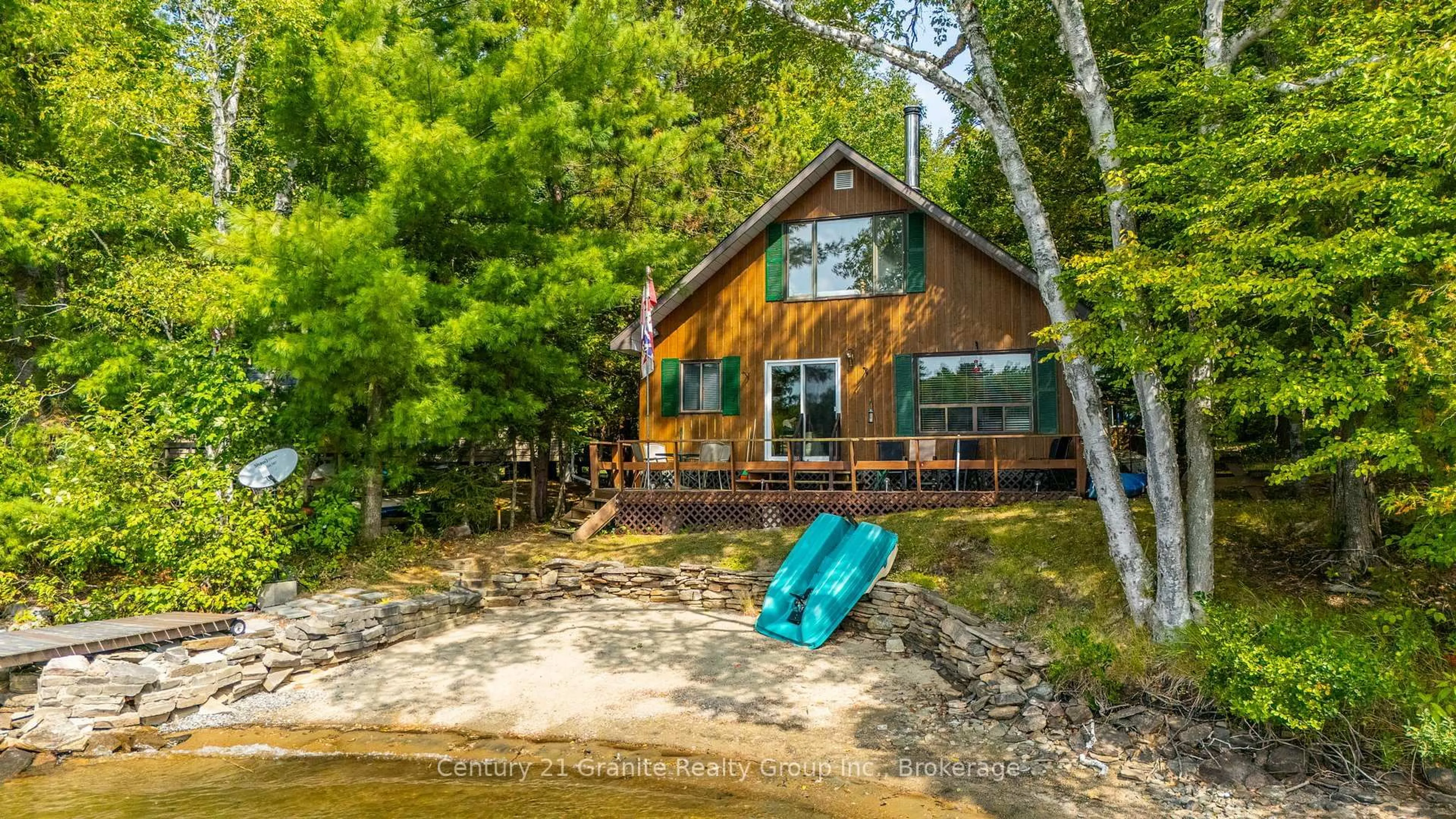 A pic from outside/outdoor area/front of a property/back of a property/a pic from drone, water/lake/river/ocean view for 1100 Fairfield Bay Dr, Minden Hills Ontario K0M 2K0