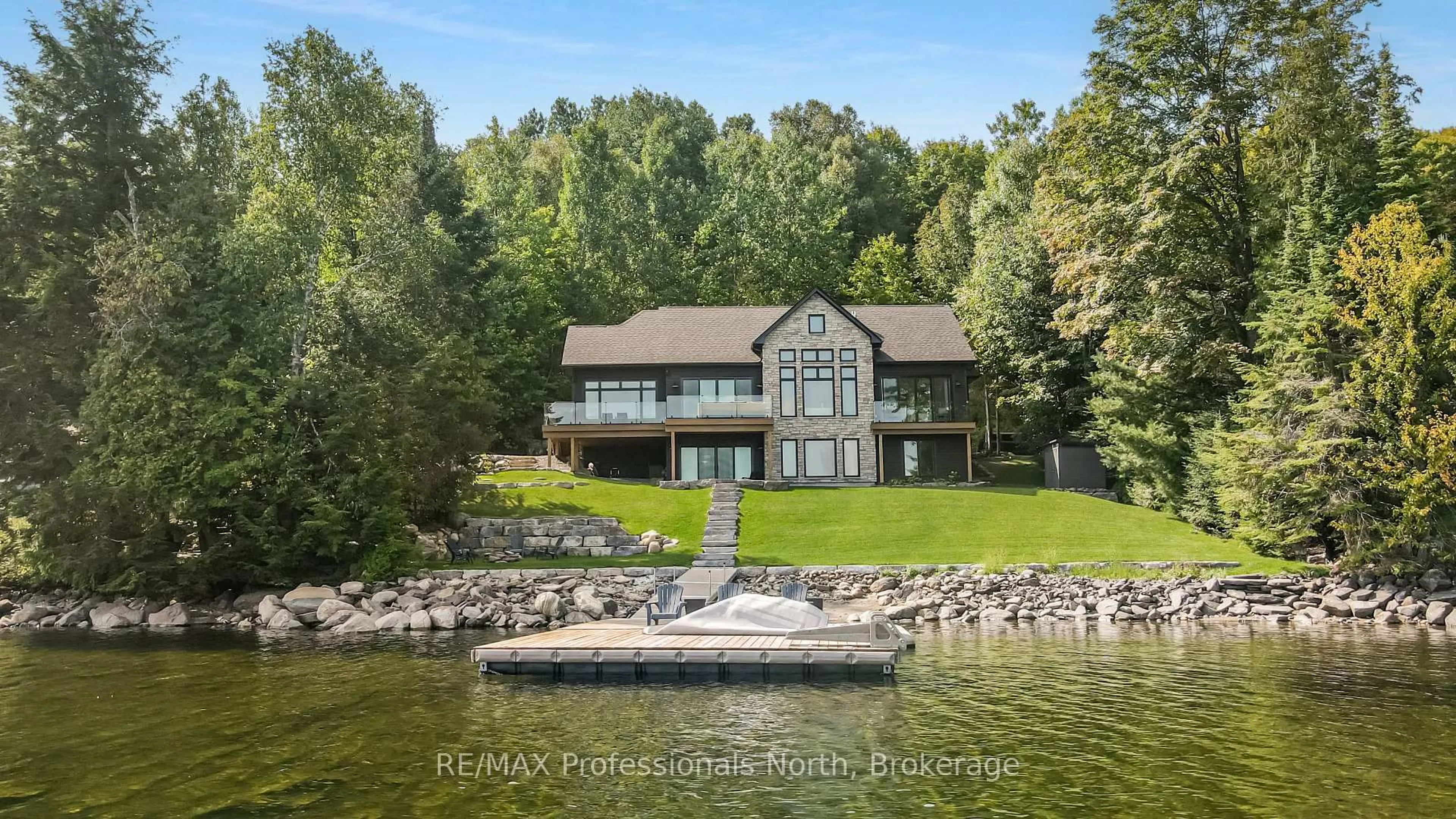 A pic from outside/outdoor area/front of a property/back of a property/a pic from drone, water/lake/river/ocean view for 1015 Treasure Dr, Dysart et al Ontario K0M 1S0