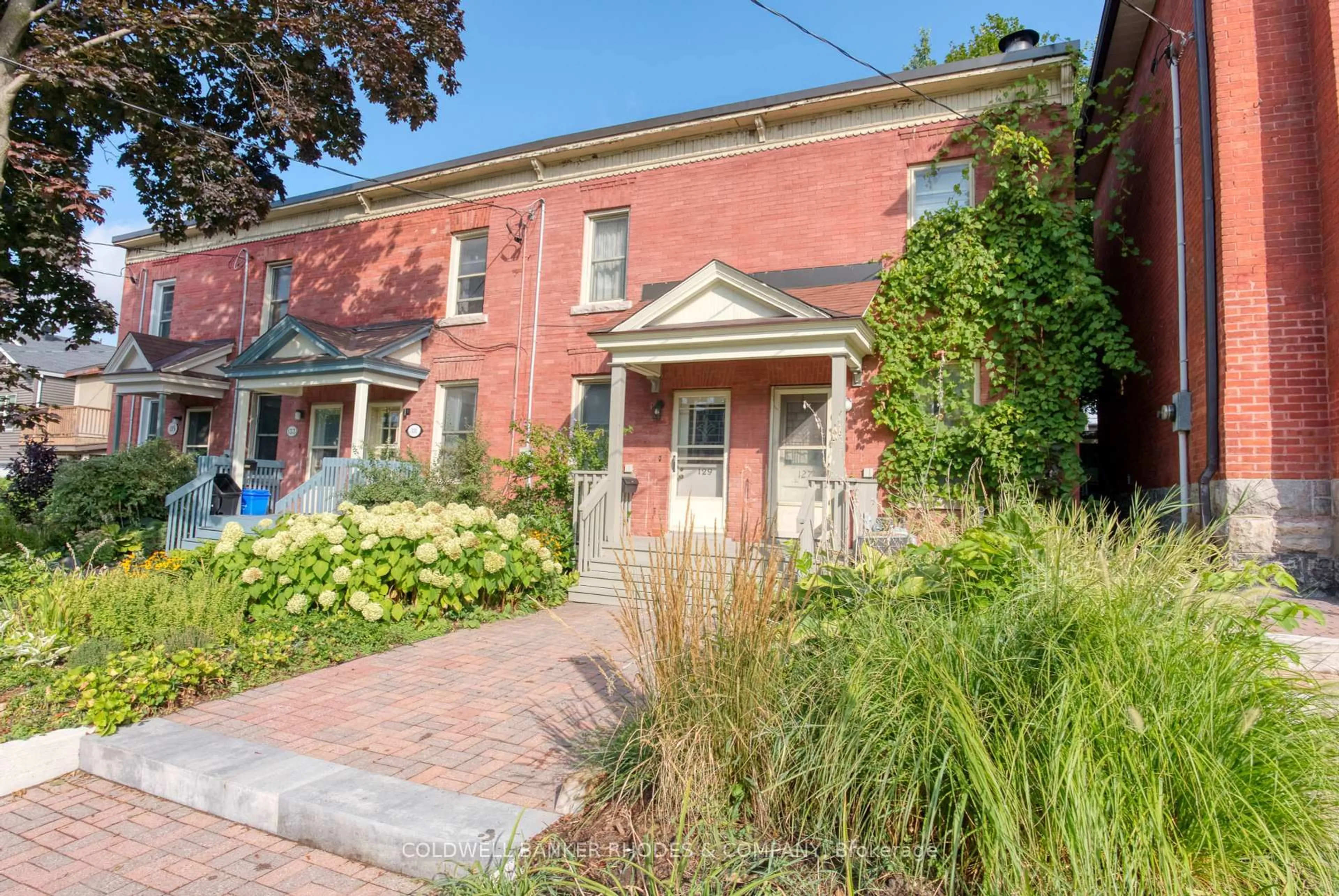 Home with brick exterior material, street for 129 Elm St, Ottawa Ontario K1R 6N4