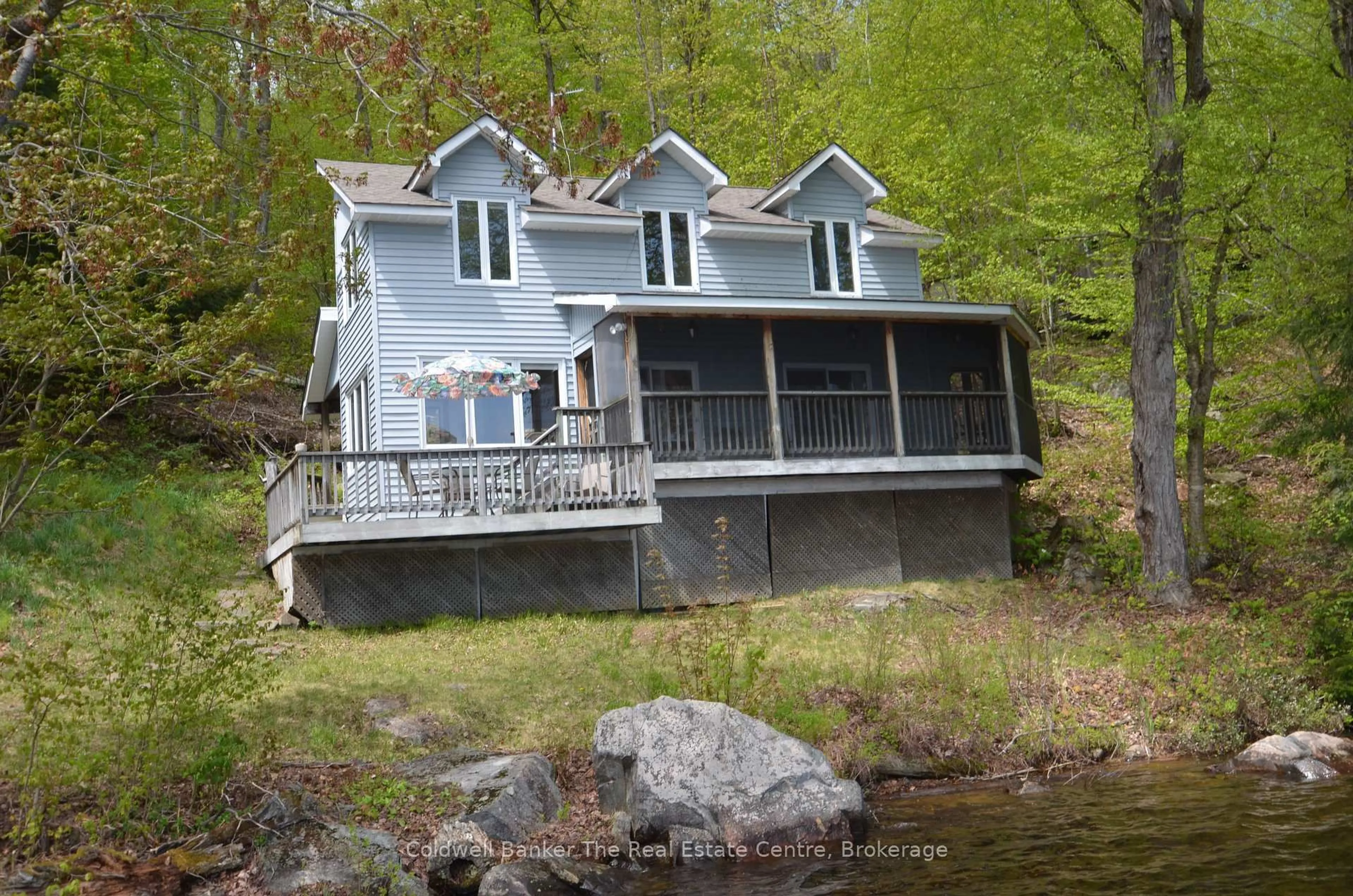 Home with vinyl exterior material, water/lake/river/ocean view for 10835 Raven - West Shore Pass, Algonquin Highlands Ontario P0A 1E0
