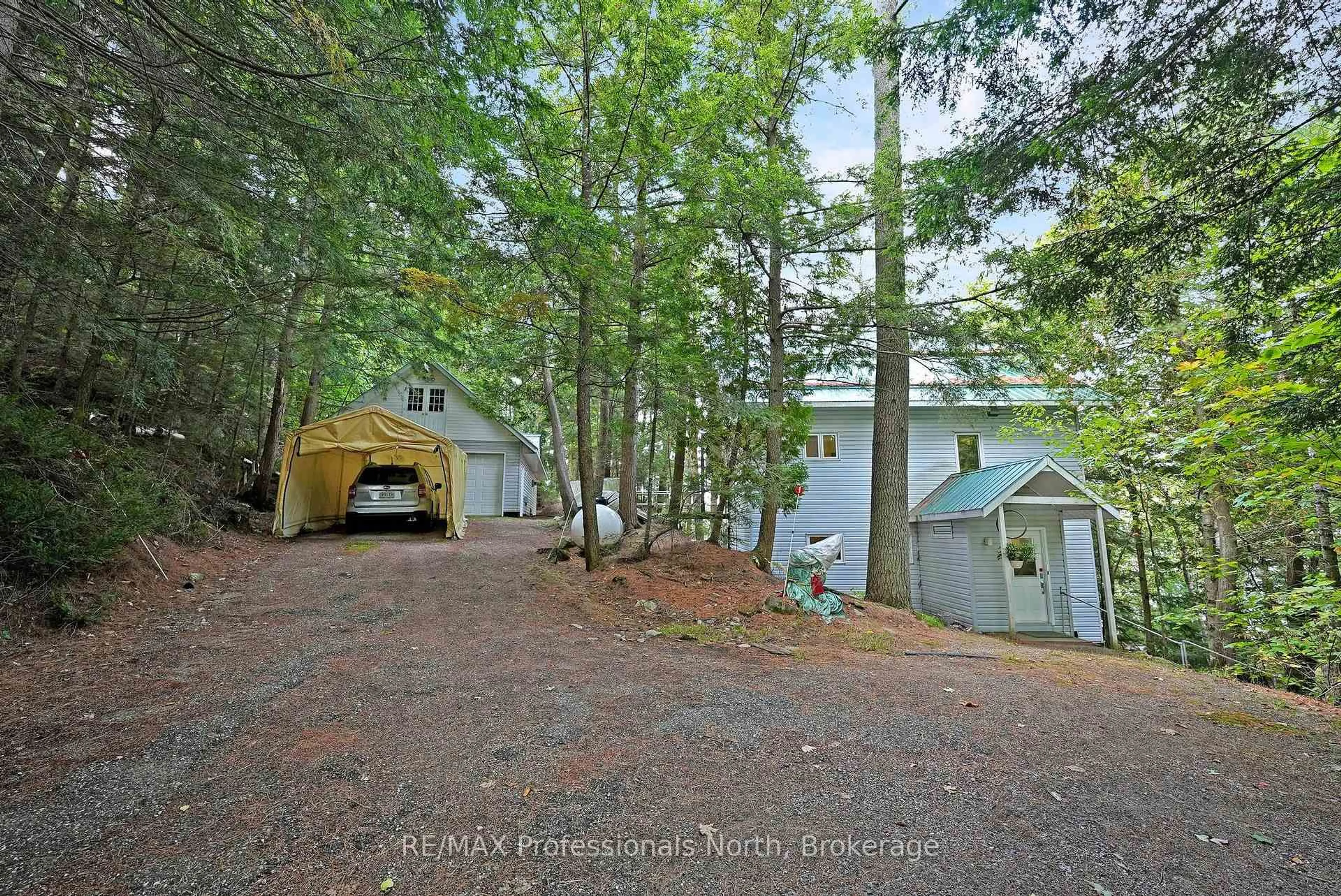 A pic from outside/outdoor area/front of a property/back of a property/a pic from drone, forest/trees view for 20871 Highway 35, Algonquin Highlands Ontario K0M 1S0