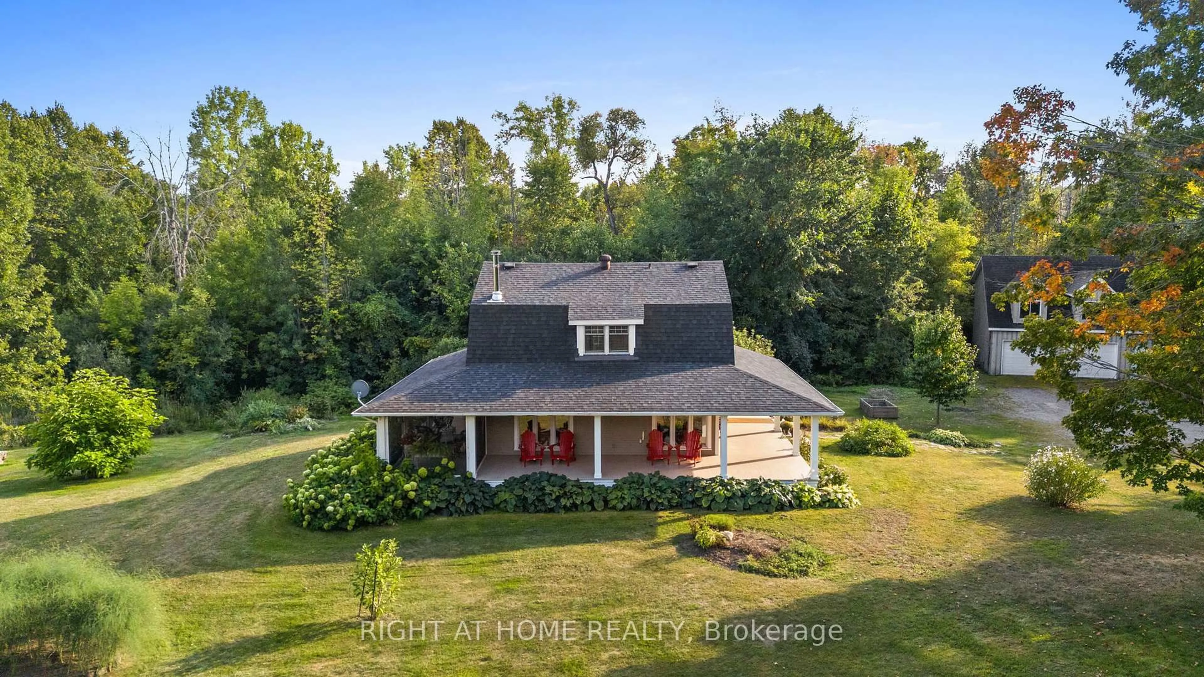 A pic from outside/outdoor area/front of a property/back of a property/a pic from drone, water/lake/river/ocean view for 689 Rideau River Rd, Merrickville Ontario K0G 1N0