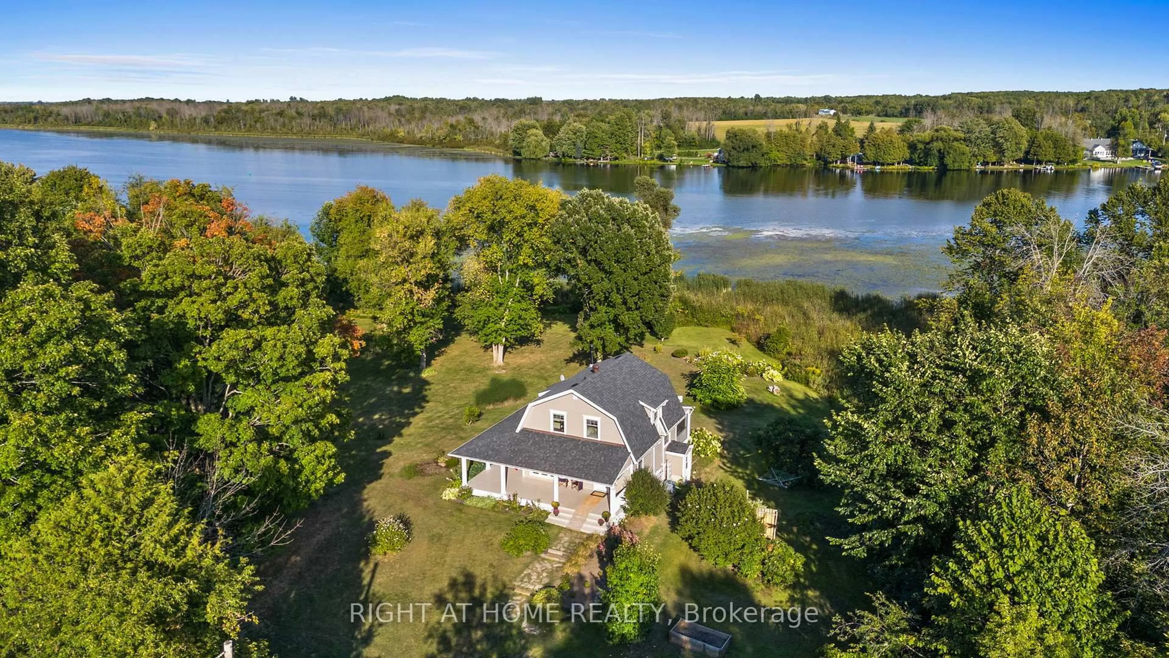 A pic from outside/outdoor area/front of a property/back of a property/a pic from drone, water/lake/river/ocean view for 689 Rideau River Rd, Merrickville Ontario K0G 1N0