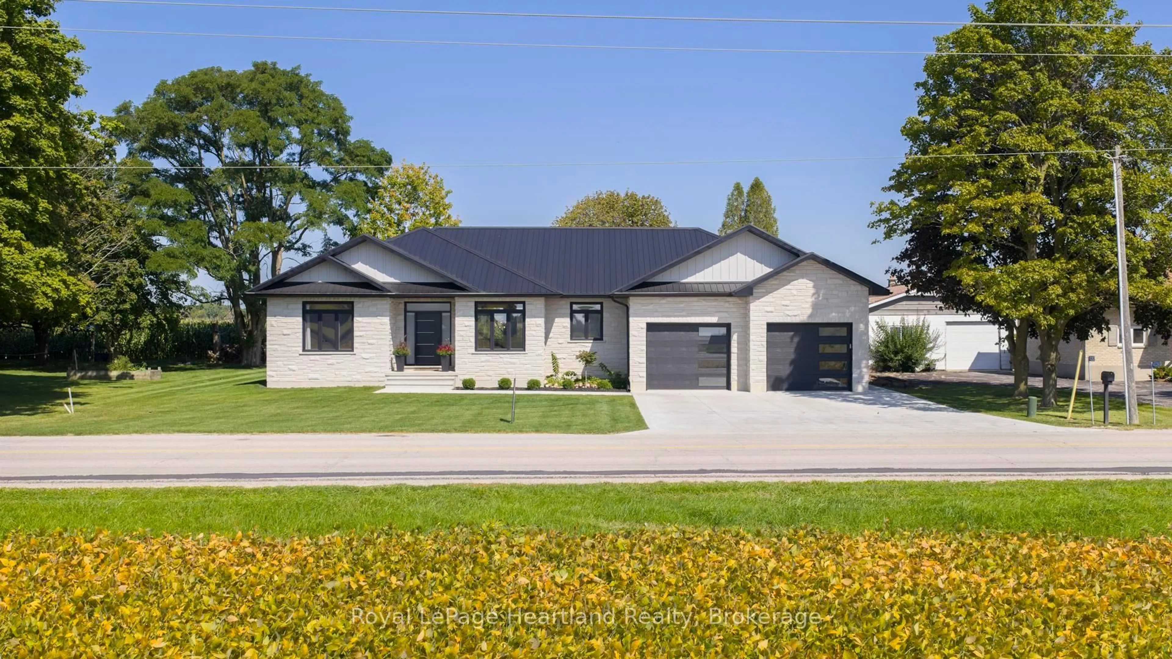 Home with vinyl exterior material, street for 40282 Huron St, South Huron Ontario N0M 1S1
