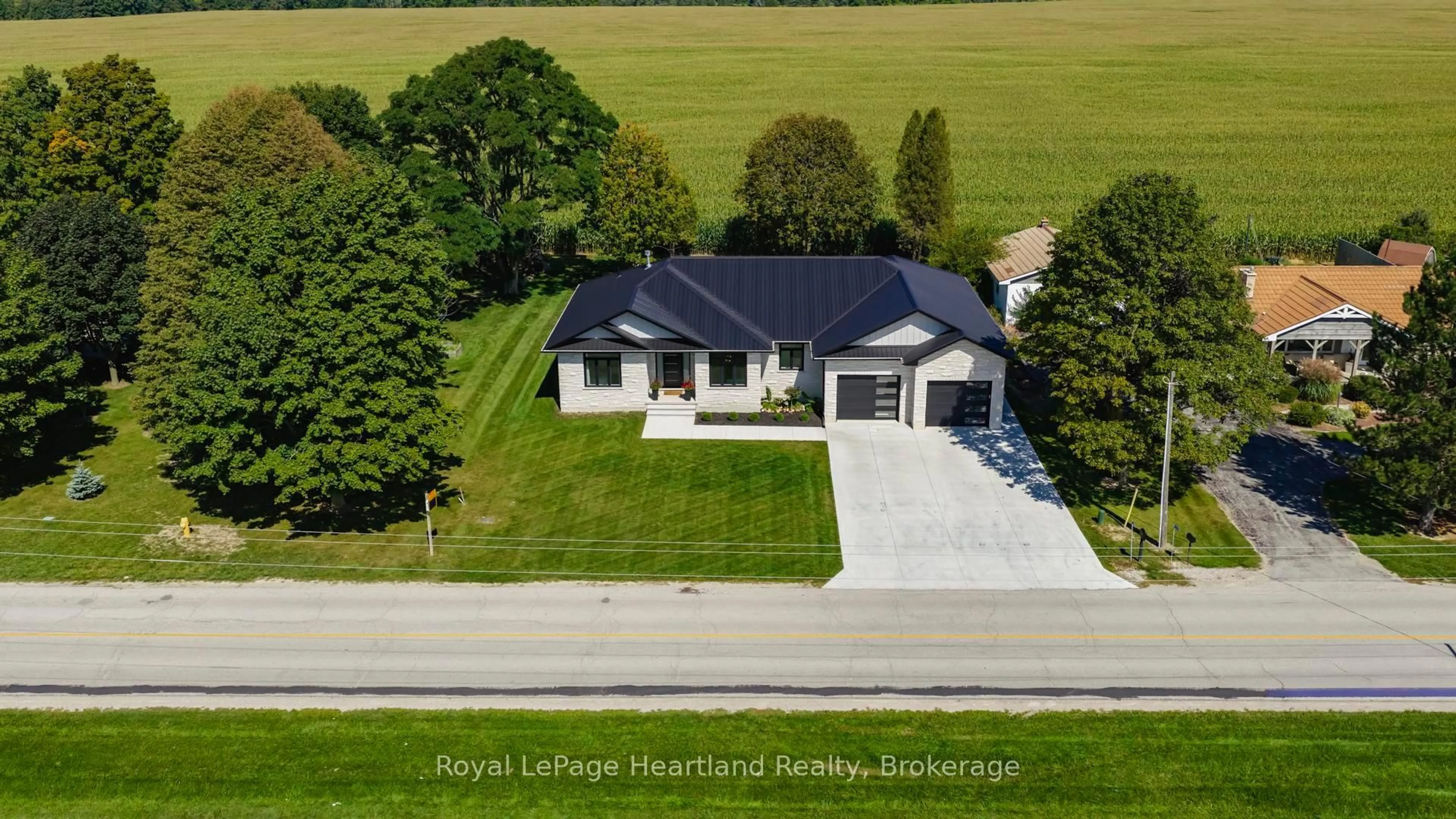 A pic from outside/outdoor area/front of a property/back of a property/a pic from drone, street for 40282 Huron St, South Huron Ontario N0M 1S1