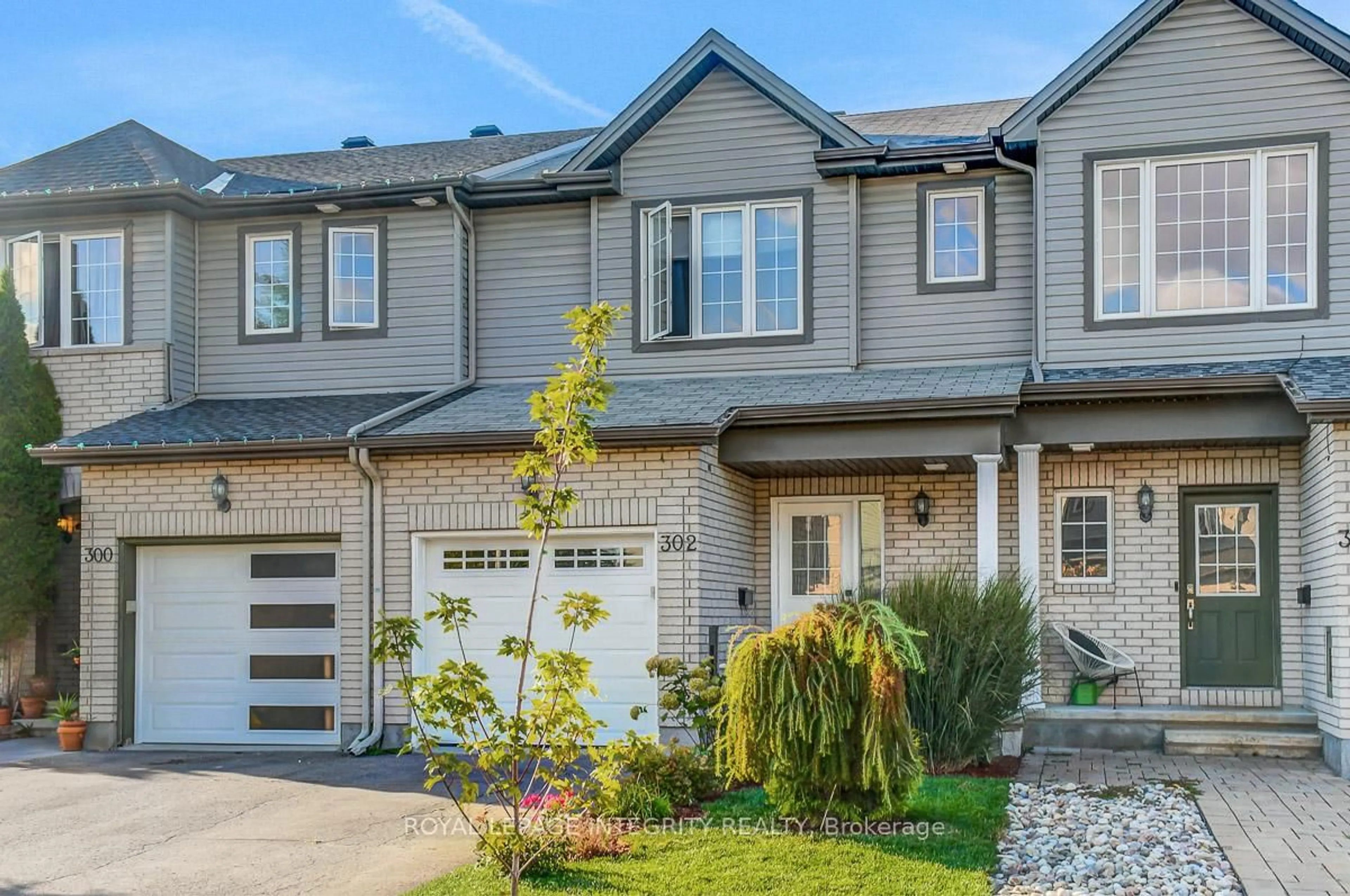 Home with brick exterior material, street for 302 Brigitta St, Ottawa Ontario K2S 0H8