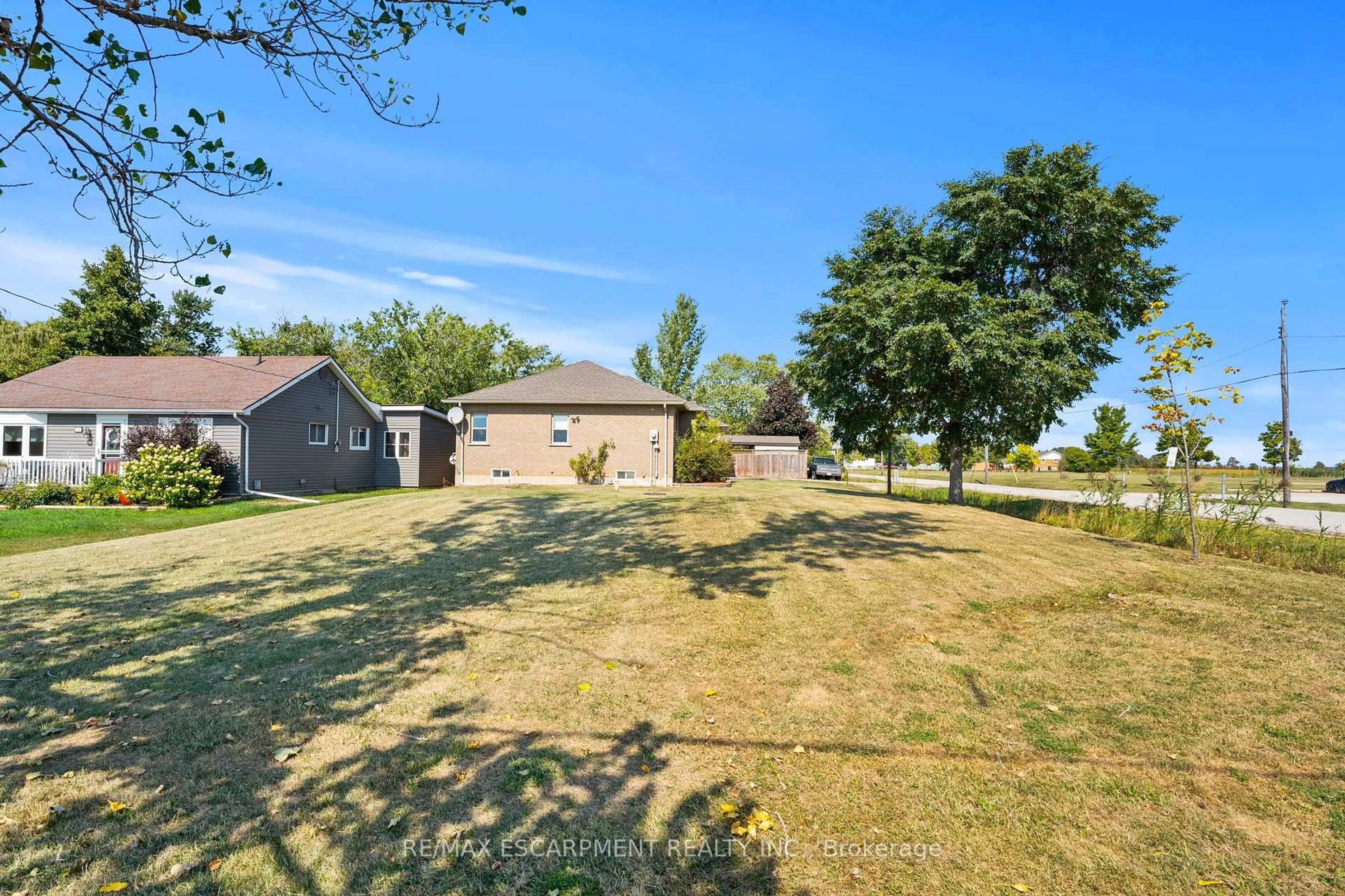 A pic from outside/outdoor area/front of a property/back of a property/a pic from drone, water/lake/river/ocean view for 301 Mud St, Hamilton Ontario L8J 2X7