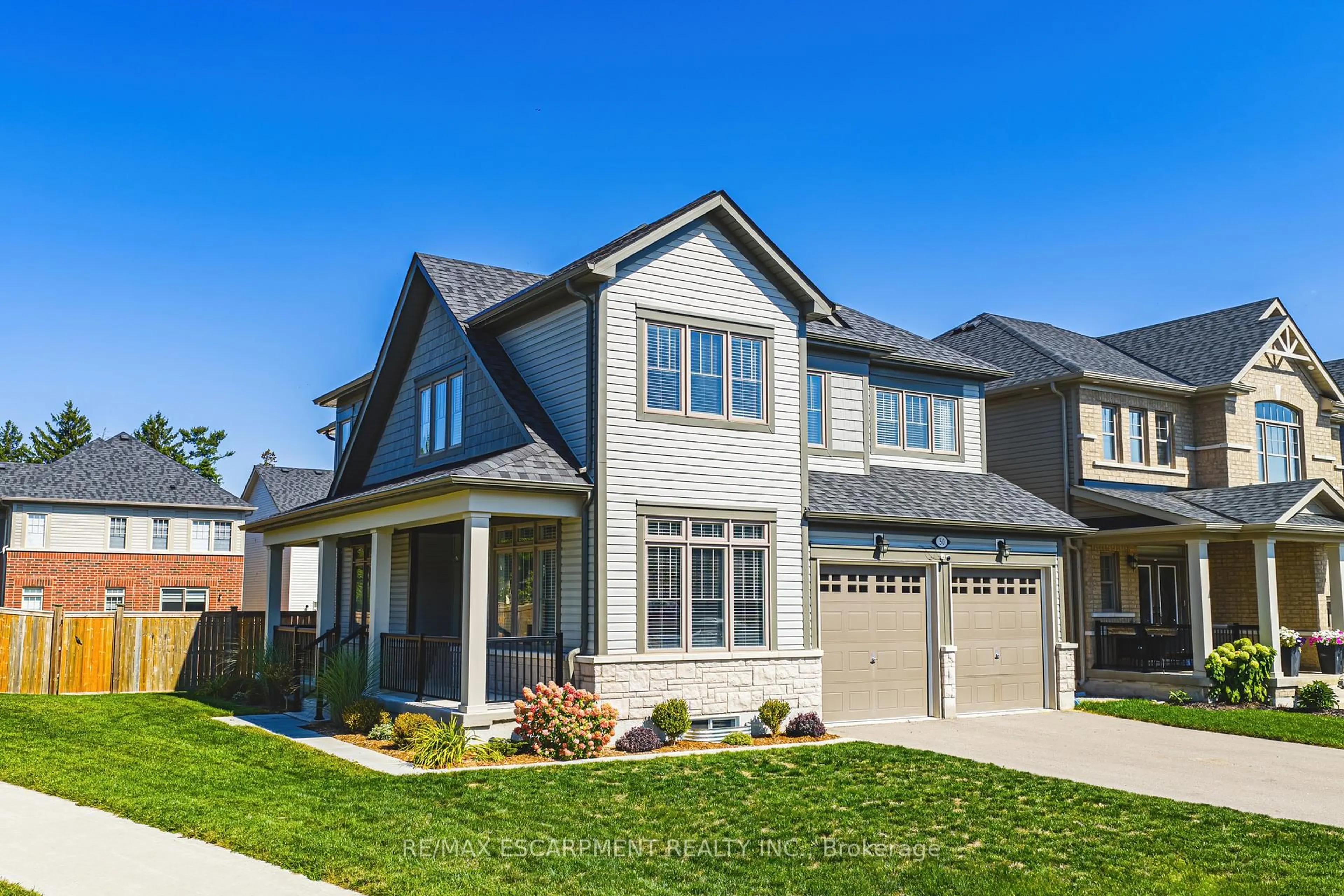 Home with vinyl exterior material, street for 50 Ready Rd, Centre Wellington Ontario N1M 0G5