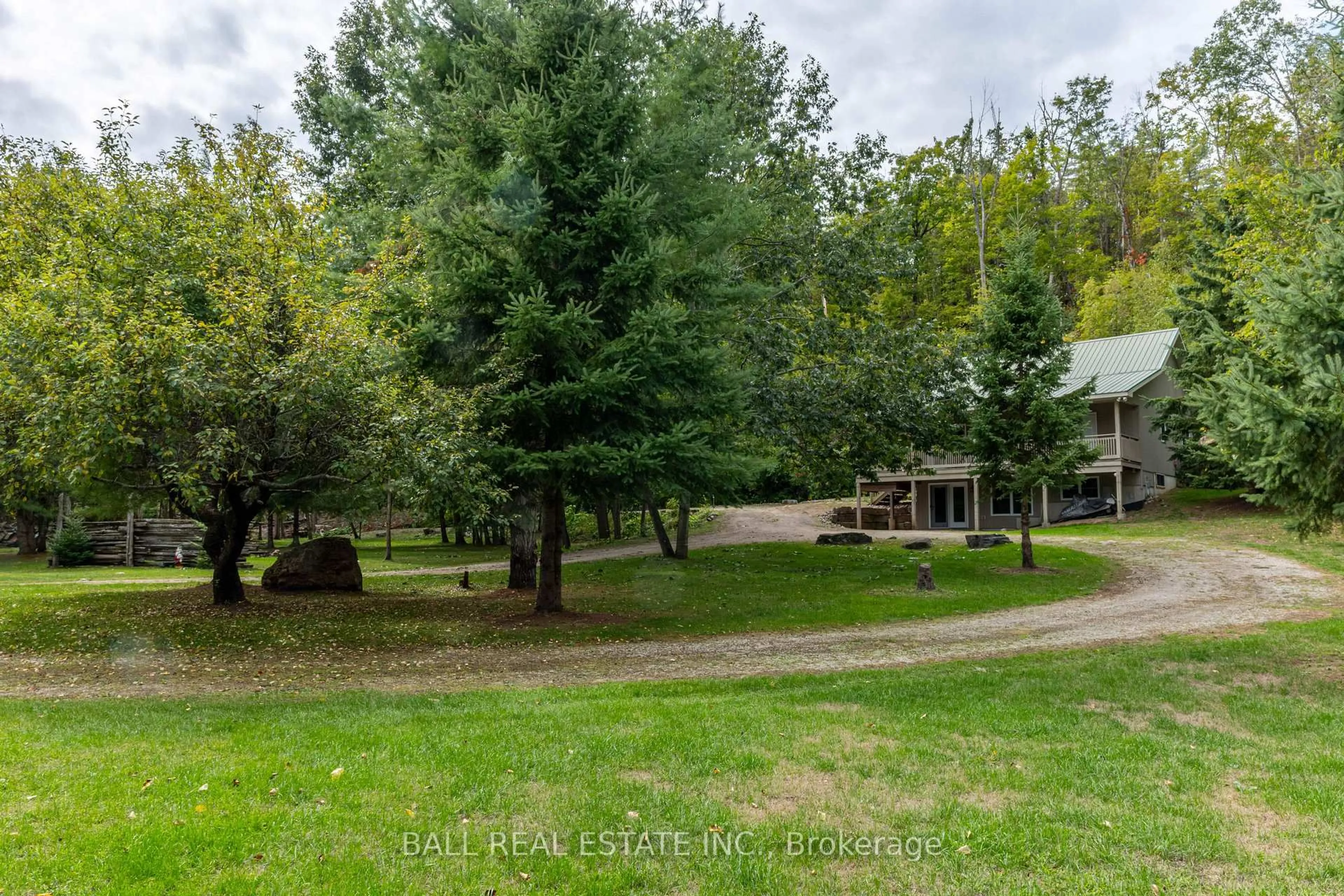 A pic from outside/outdoor area/front of a property/back of a property/a pic from drone, forest/trees view for 45 Spring Dr, Trent Lakes Ontario K0M 1A0