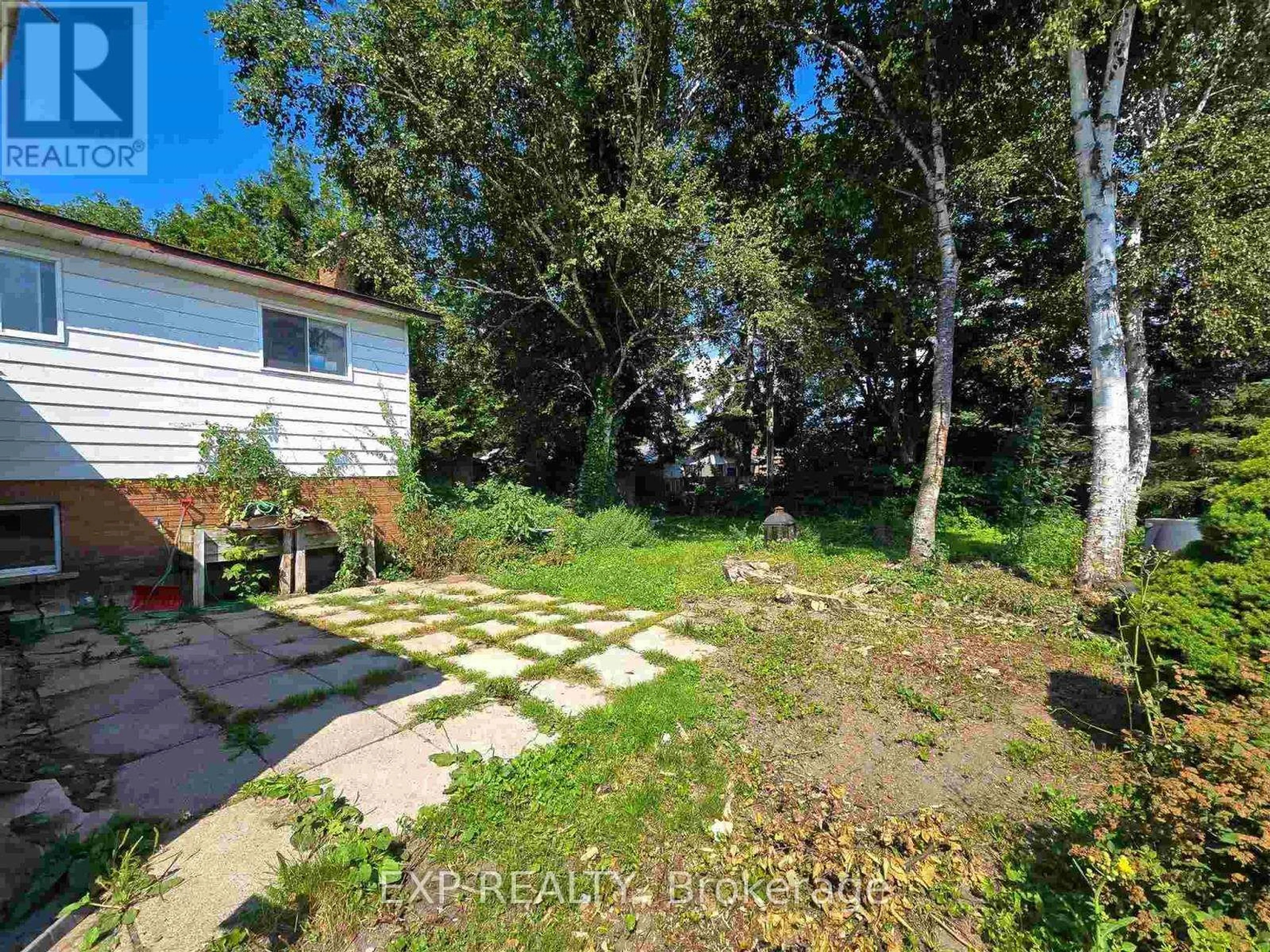 A pic from outside/outdoor area/front of a property/back of a property/a pic from drone, forest/trees view for 14 Admiral Dr, Sault Ste Marie Ontario P6C 5W3