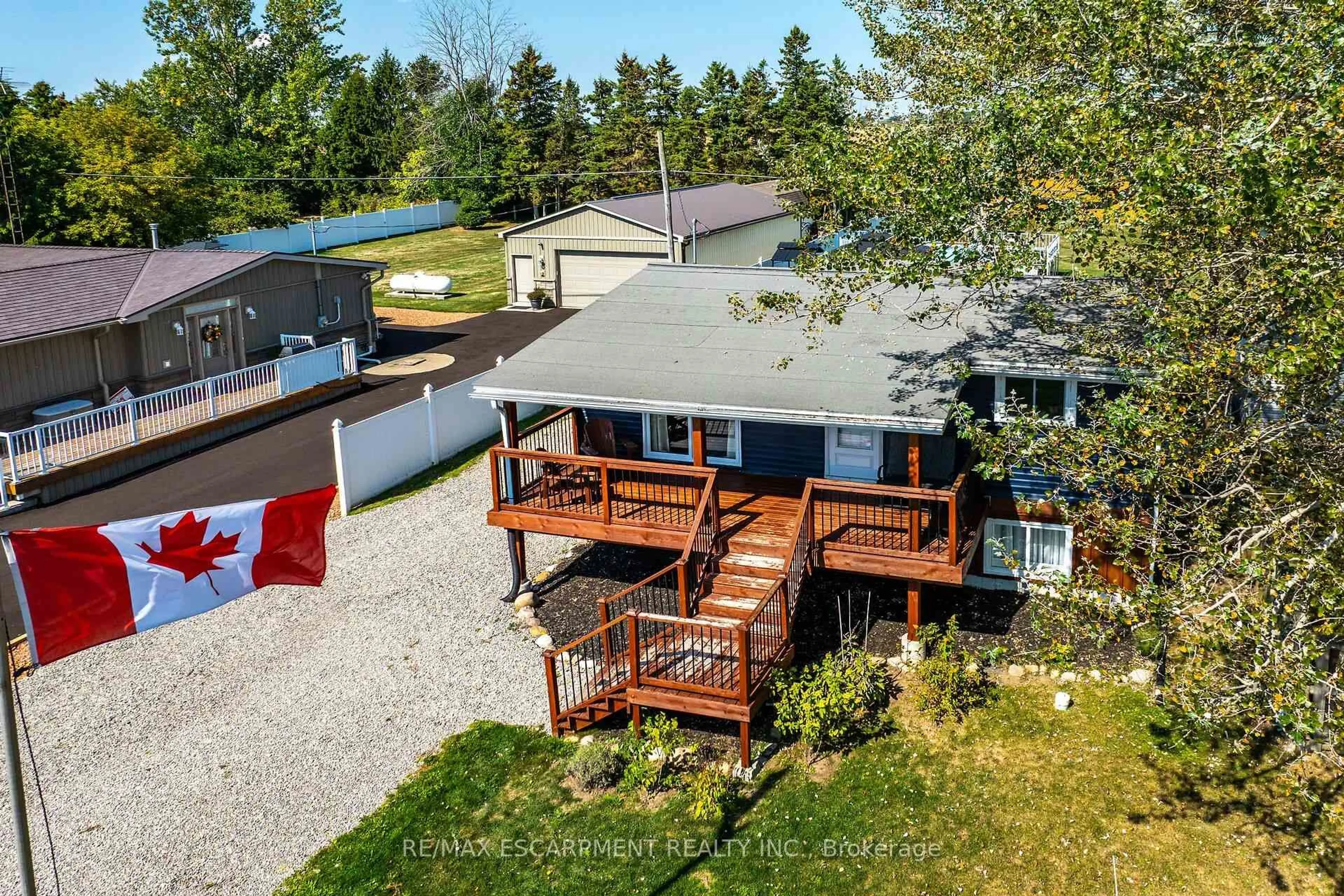 A pic from outside/outdoor area/front of a property/back of a property/a pic from drone, water/lake/river/ocean view for 1645 Lakeshore Rd, Haldimand Ontario N0A 1P0