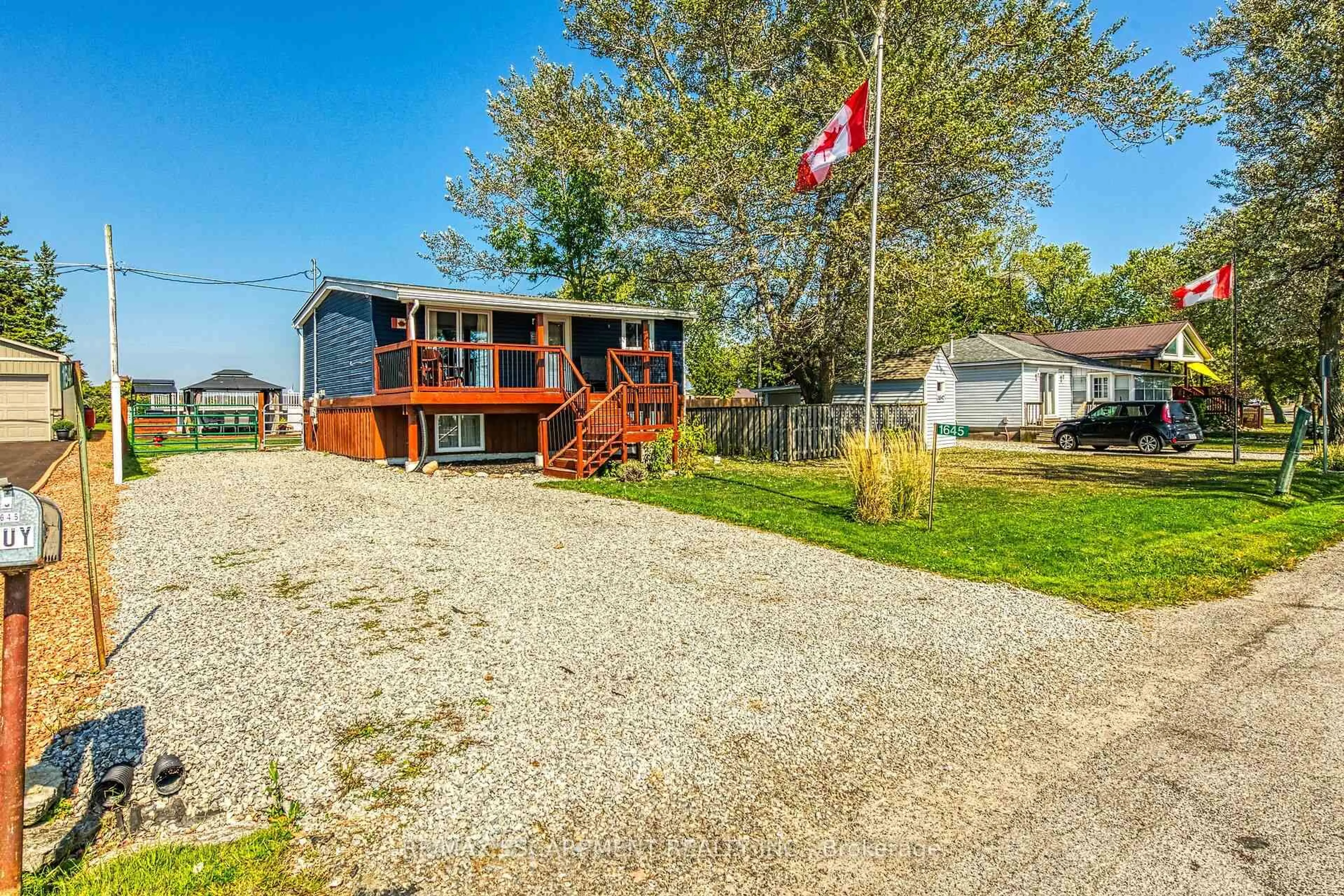A pic from outside/outdoor area/front of a property/back of a property/a pic from drone, street for 1645 Lakeshore Rd, Haldimand Ontario N0A 1P0