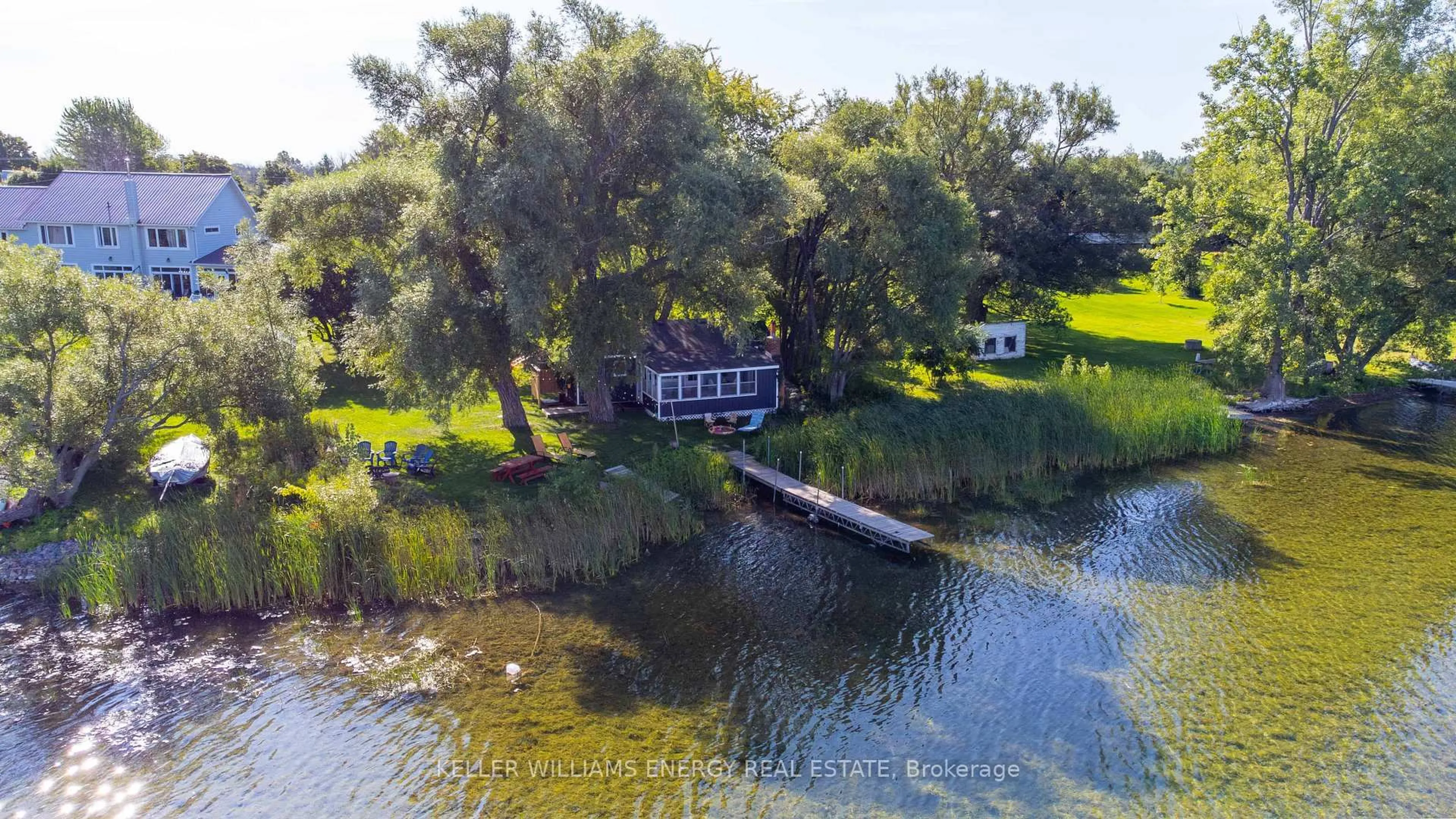 A pic from outside/outdoor area/front of a property/back of a property/a pic from drone, water/lake/river/ocean view for 2657 County Road 13, Prince Edward County Ontario K0K 2T0