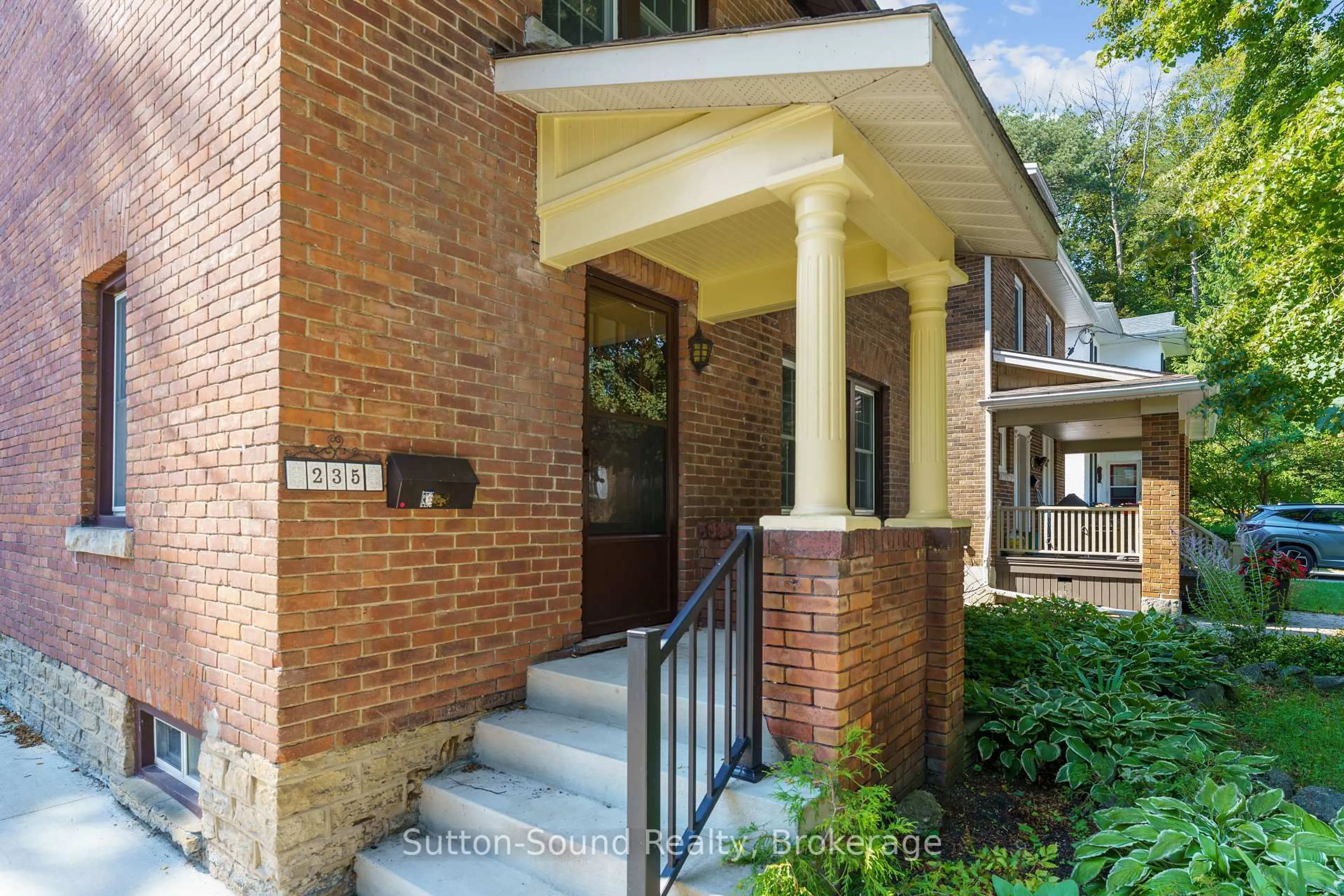 Home with brick exterior material, street for 235 7th St, Owen Sound Ontario N4K 3L3