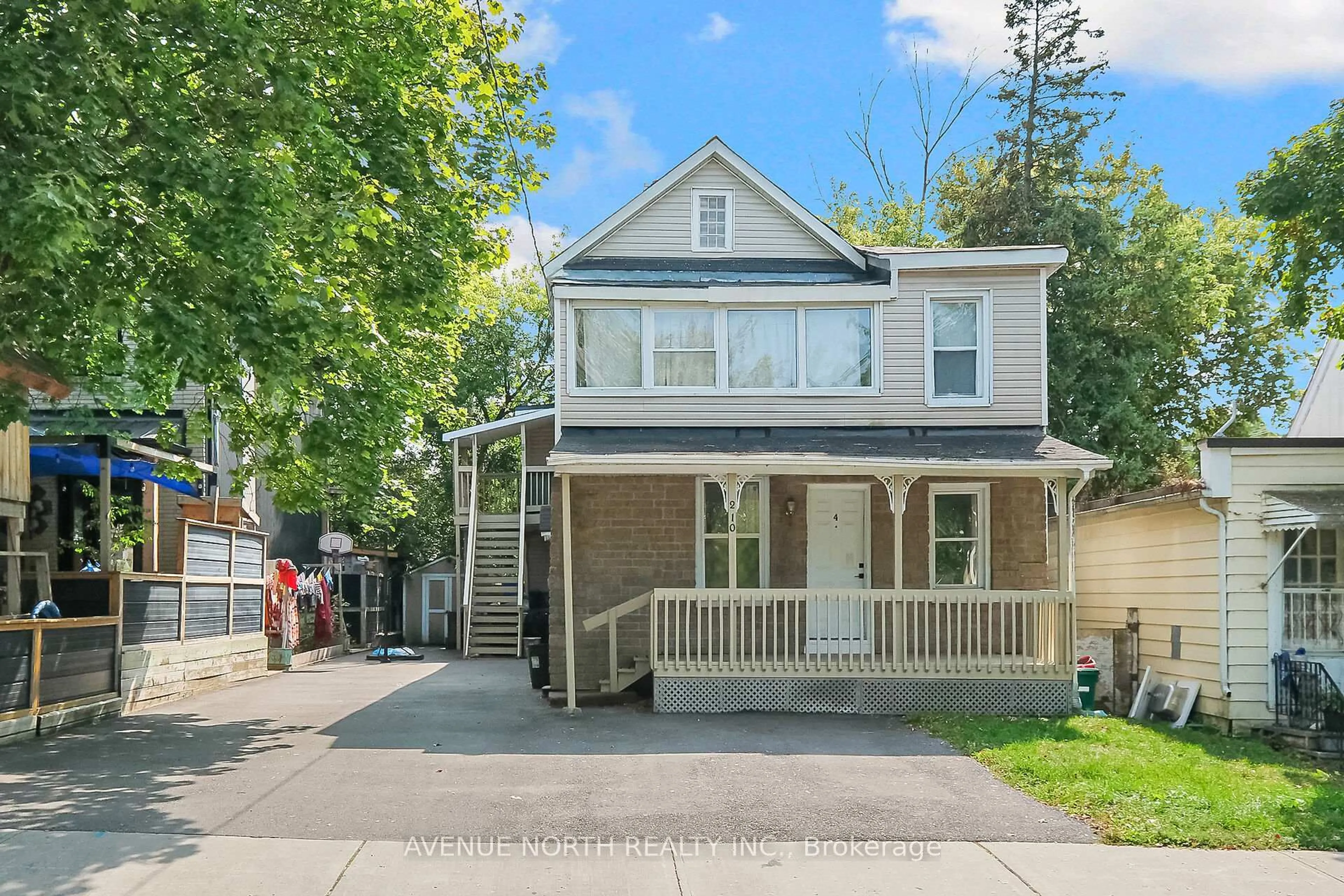 Home with vinyl exterior material, street for 210 Dagmar Ave, Ottawa Ontario K1L 5S9