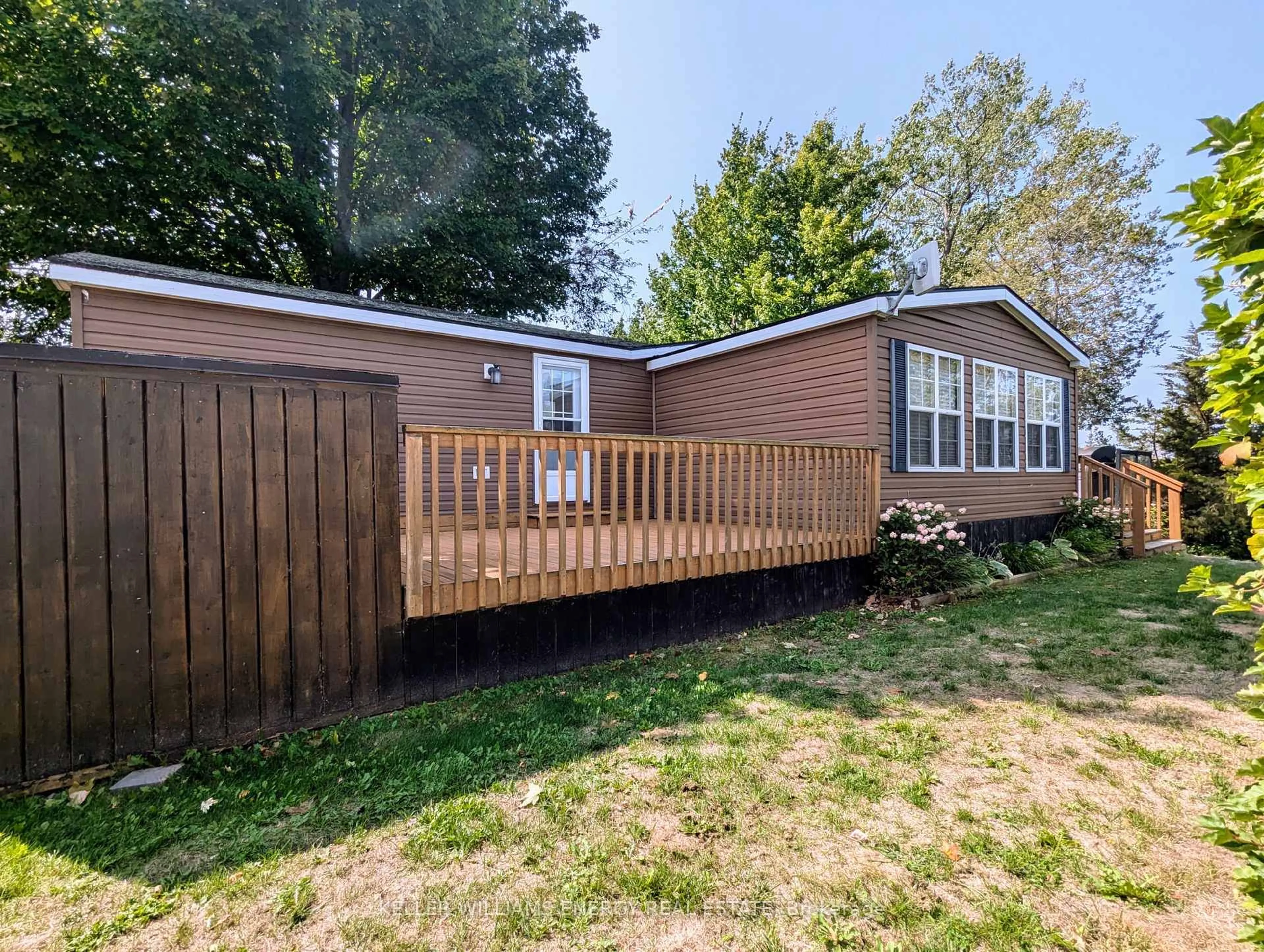 Home with vinyl exterior material, water/lake/river/ocean view for 486 County Road 18 Cherry Beach Lane Rd ##54, Prince Edward County Ontario K0K 1P0