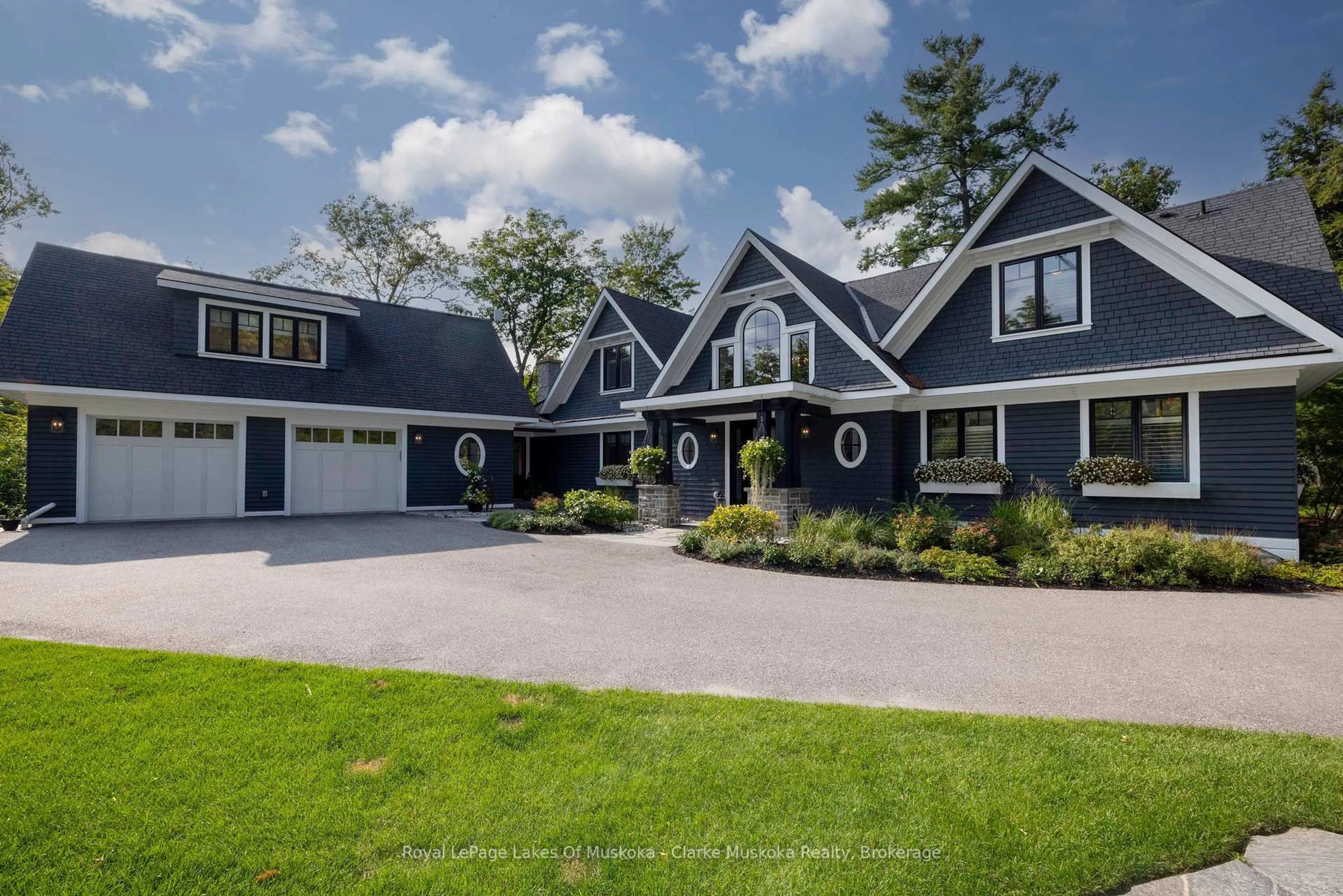 Home with vinyl exterior material, street for 1079 Trillium Rd, Muskoka Lakes Ontario P0B 1J0