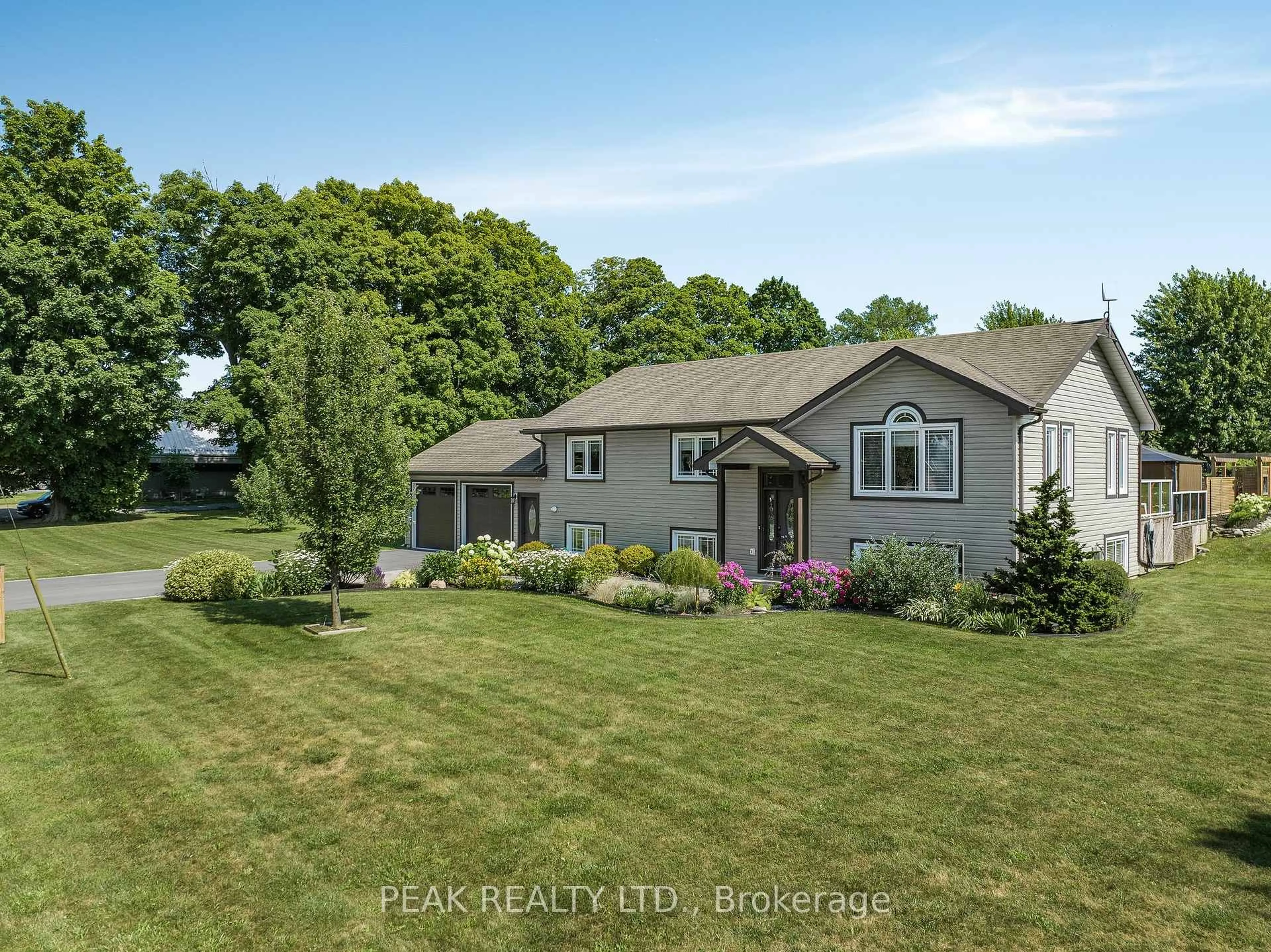 A pic from outside/outdoor area/front of a property/back of a property/a pic from drone, water/lake/river/ocean view for 116 Prinyers Cove Cres, Prince Edward County Ontario K0K 2T0