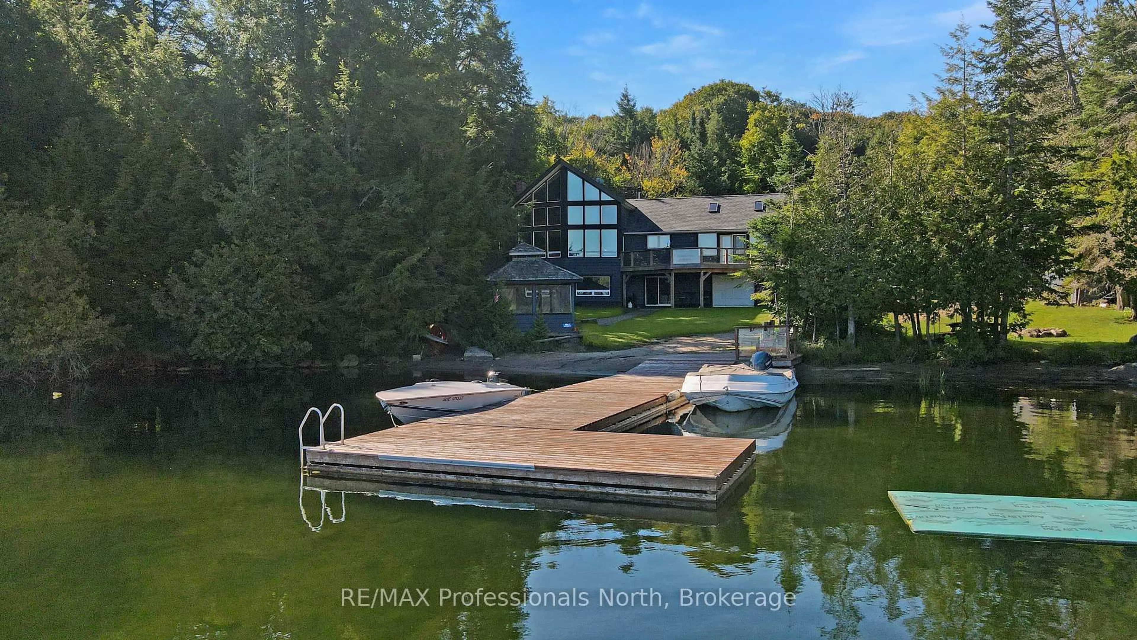 A pic from outside/outdoor area/front of a property/back of a property/a pic from drone, water/lake/river/ocean view for 1645 Allen Lake Dr, Dysart et al Ontario K0L 1X0