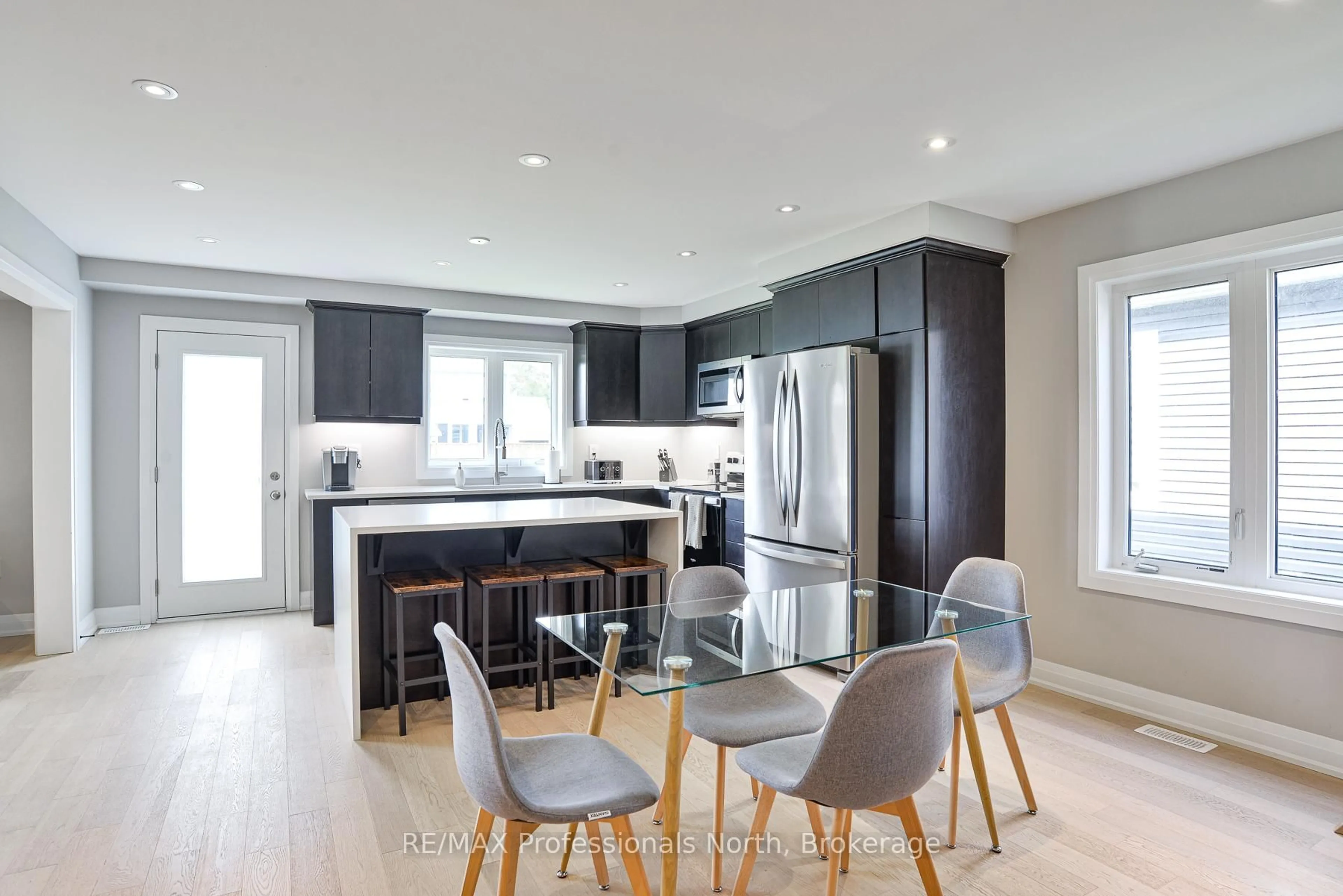 Open concept kitchen, wood/laminate floor for 21 Chambery St, Bracebridge Ontario P1L 0N4
