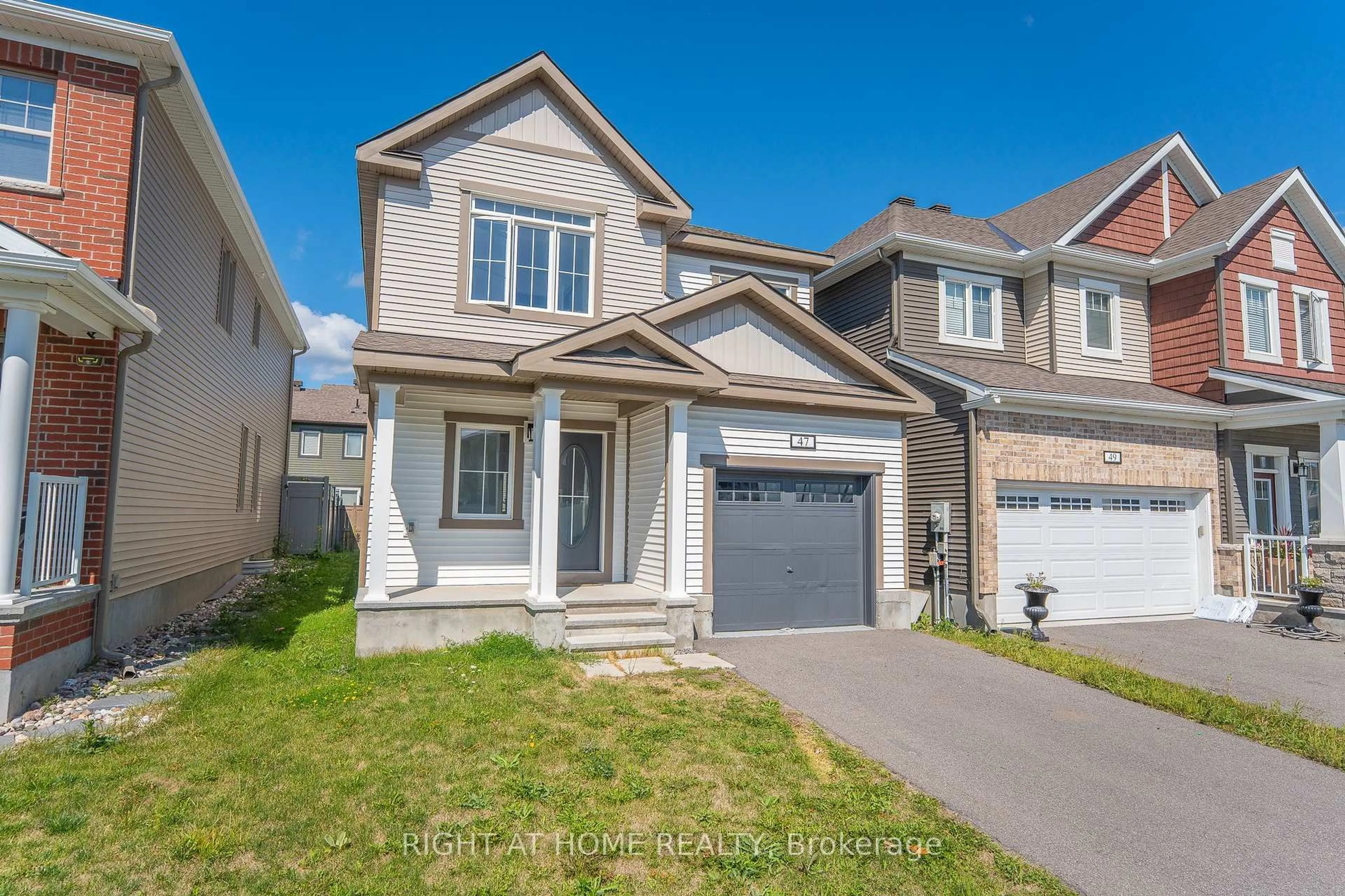 Home with vinyl exterior material, street for 47 Mudminnow Cres, Orleans Ontario K4A 5H9