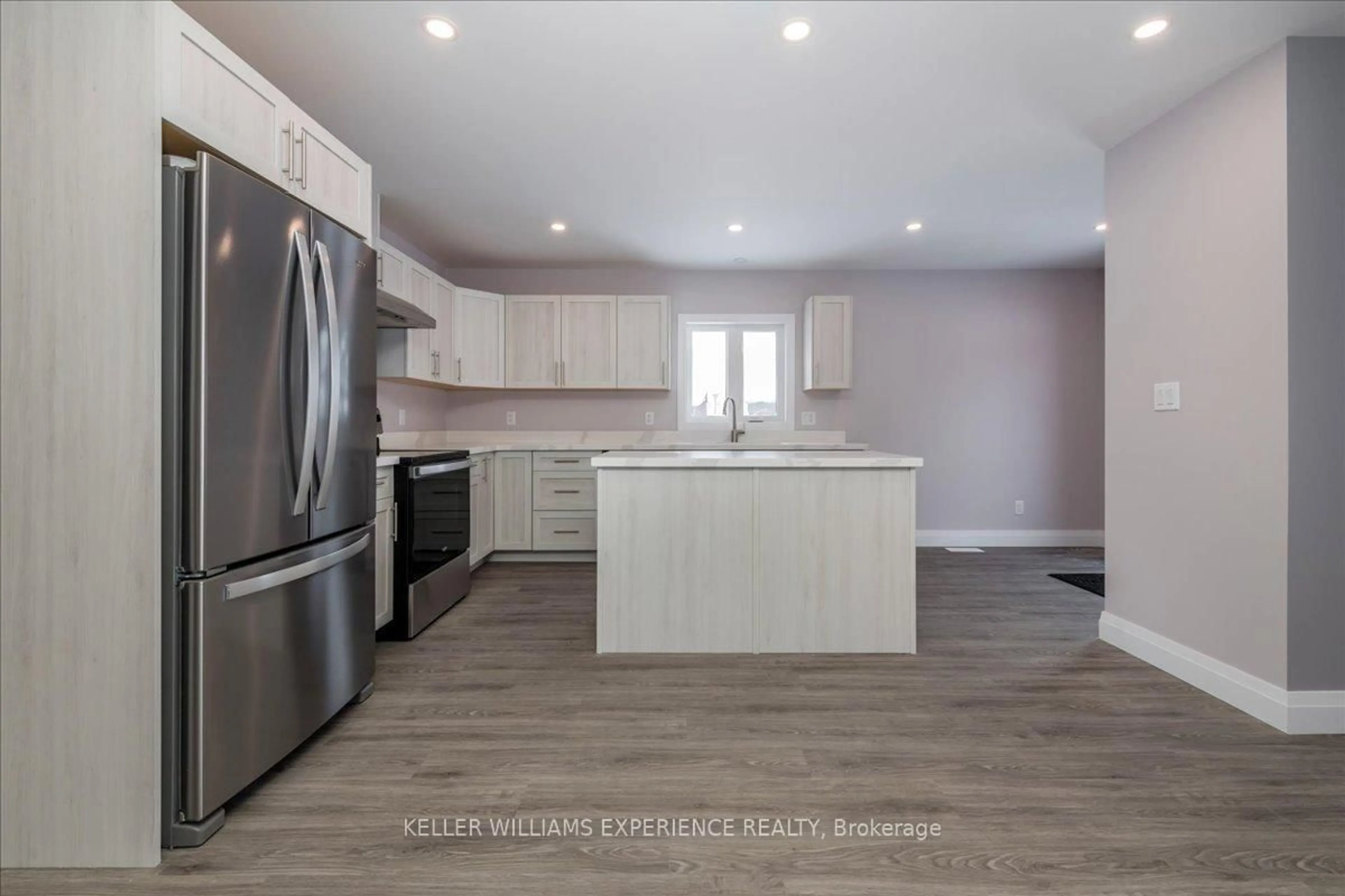 Open concept kitchen, wood/laminate floor for 145 Pine St, Gravenhurst Ontario P1P 1B1