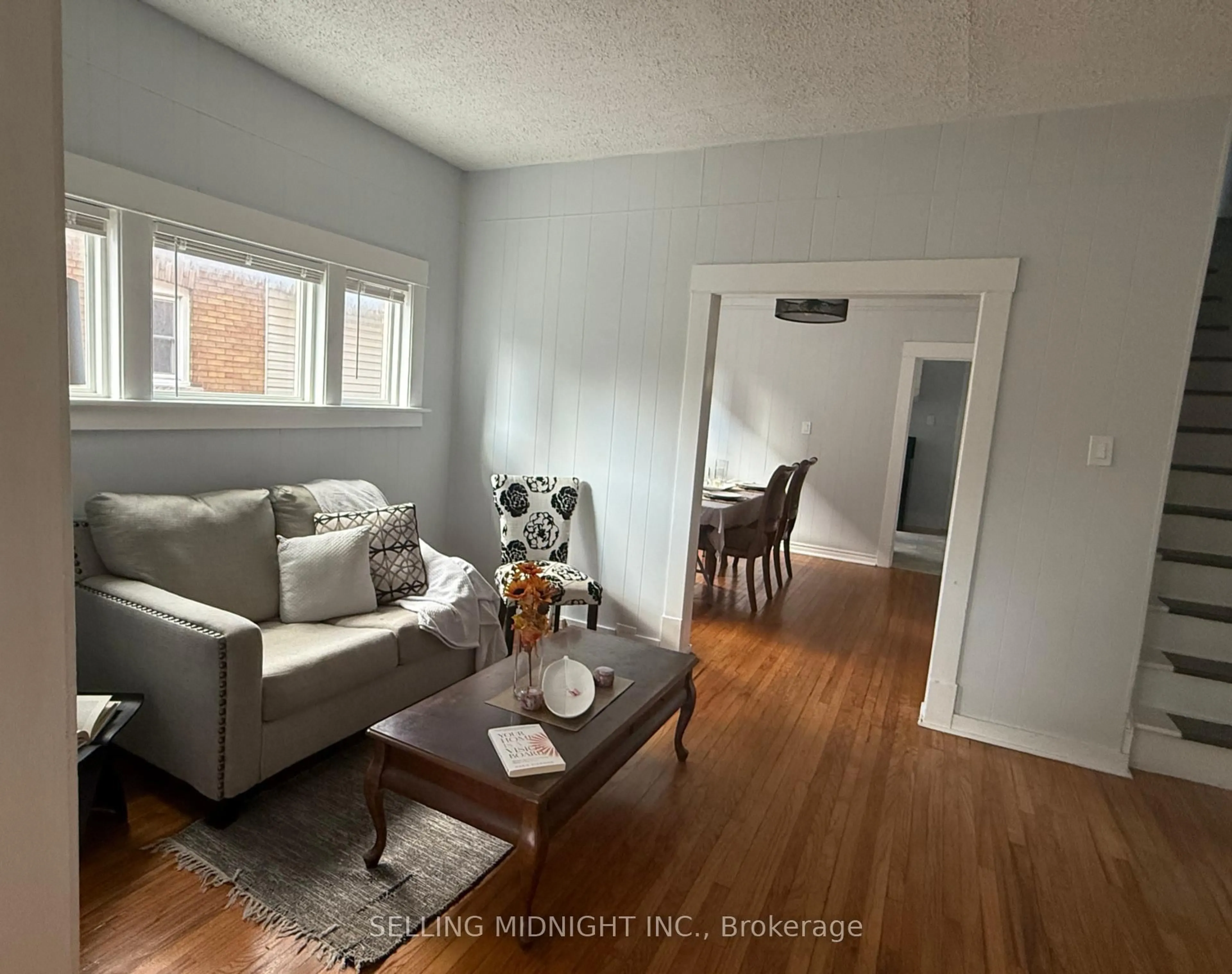 Living room with furniture, wood/laminate floor for 5341 Bridge St, Niagara Falls Ontario L2E 2T5