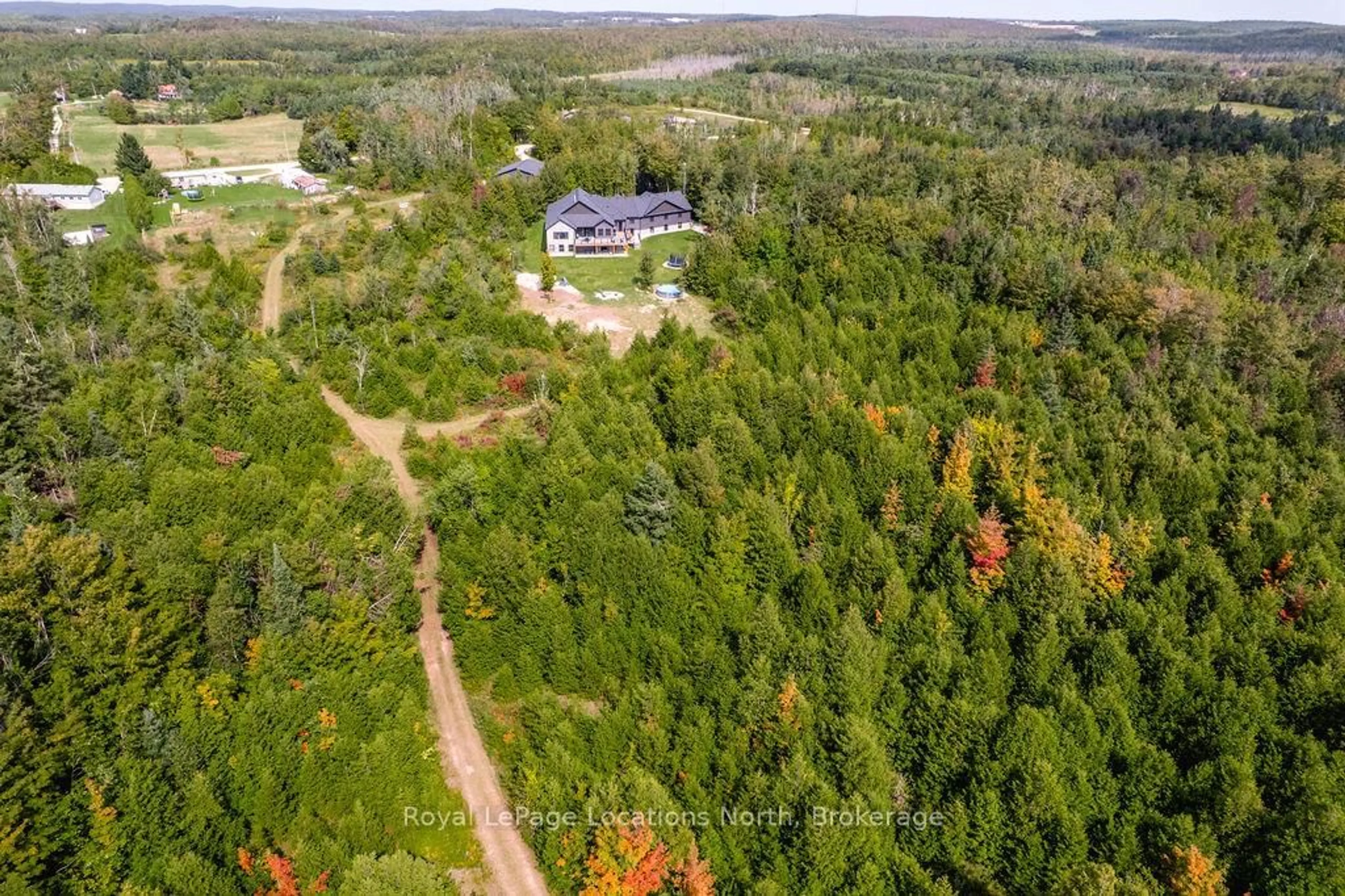 A pic from outside/outdoor area/front of a property/back of a property/a pic from drone, forest/trees view for 429540 8th B Concession, Grey Highlands Ontario N0C 1M0