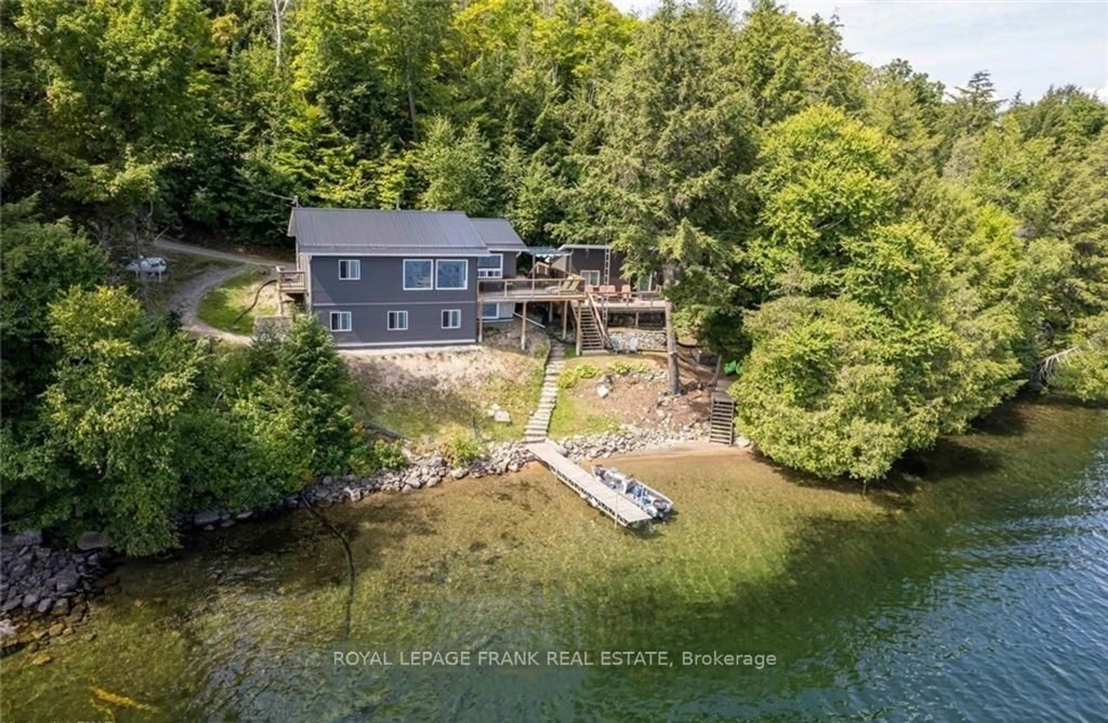 A pic from outside/outdoor area/front of a property/back of a property/a pic from drone, water/lake/river/ocean view for 1758 Papineau Lake Rd, Maple Leaf Ontario K0L 2R0