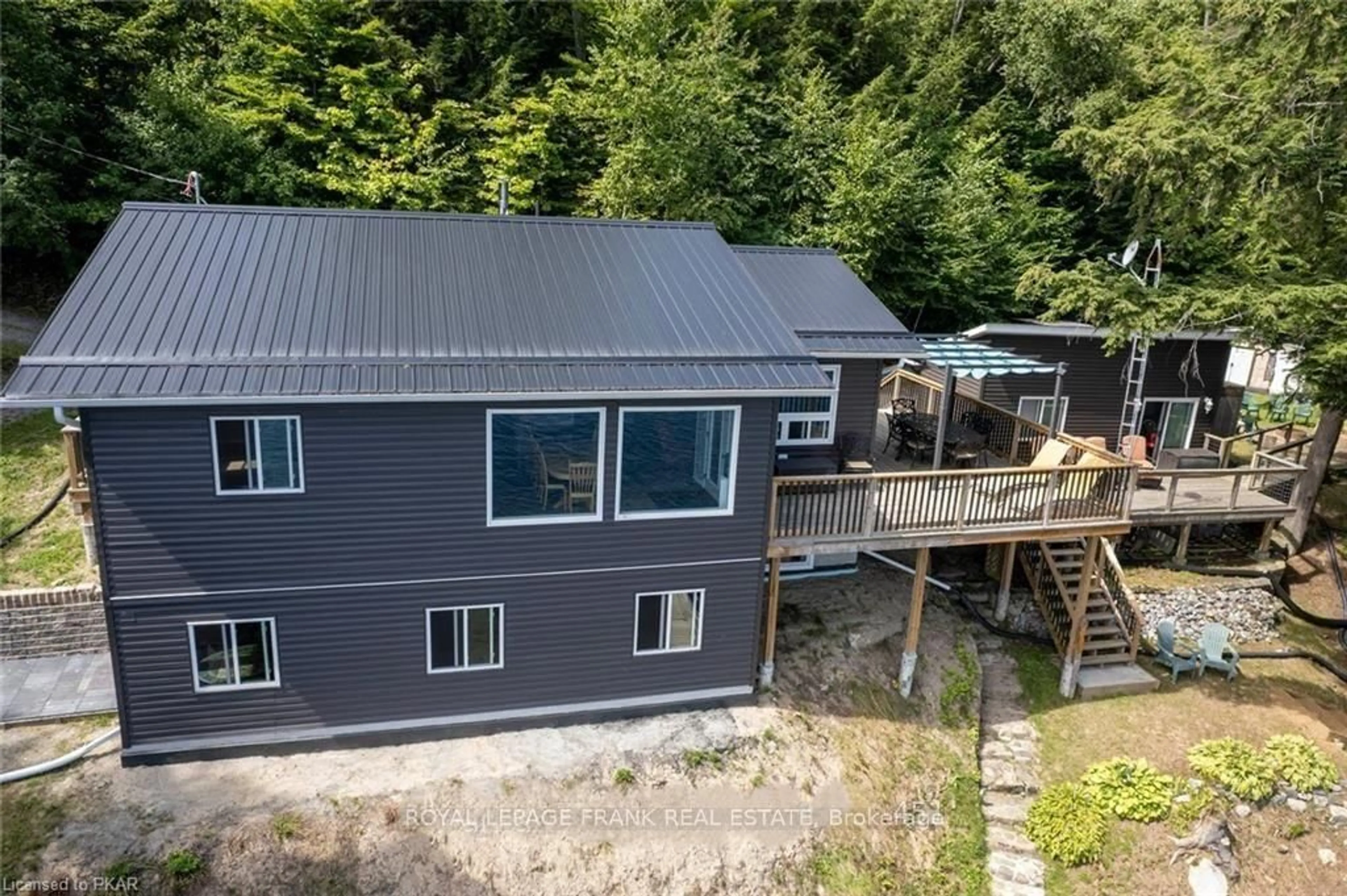 A pic from outside/outdoor area/front of a property/back of a property/a pic from drone, water/lake/river/ocean view for 1758 Papineau Lake Rd, Maple Leaf Ontario K0L 2R0