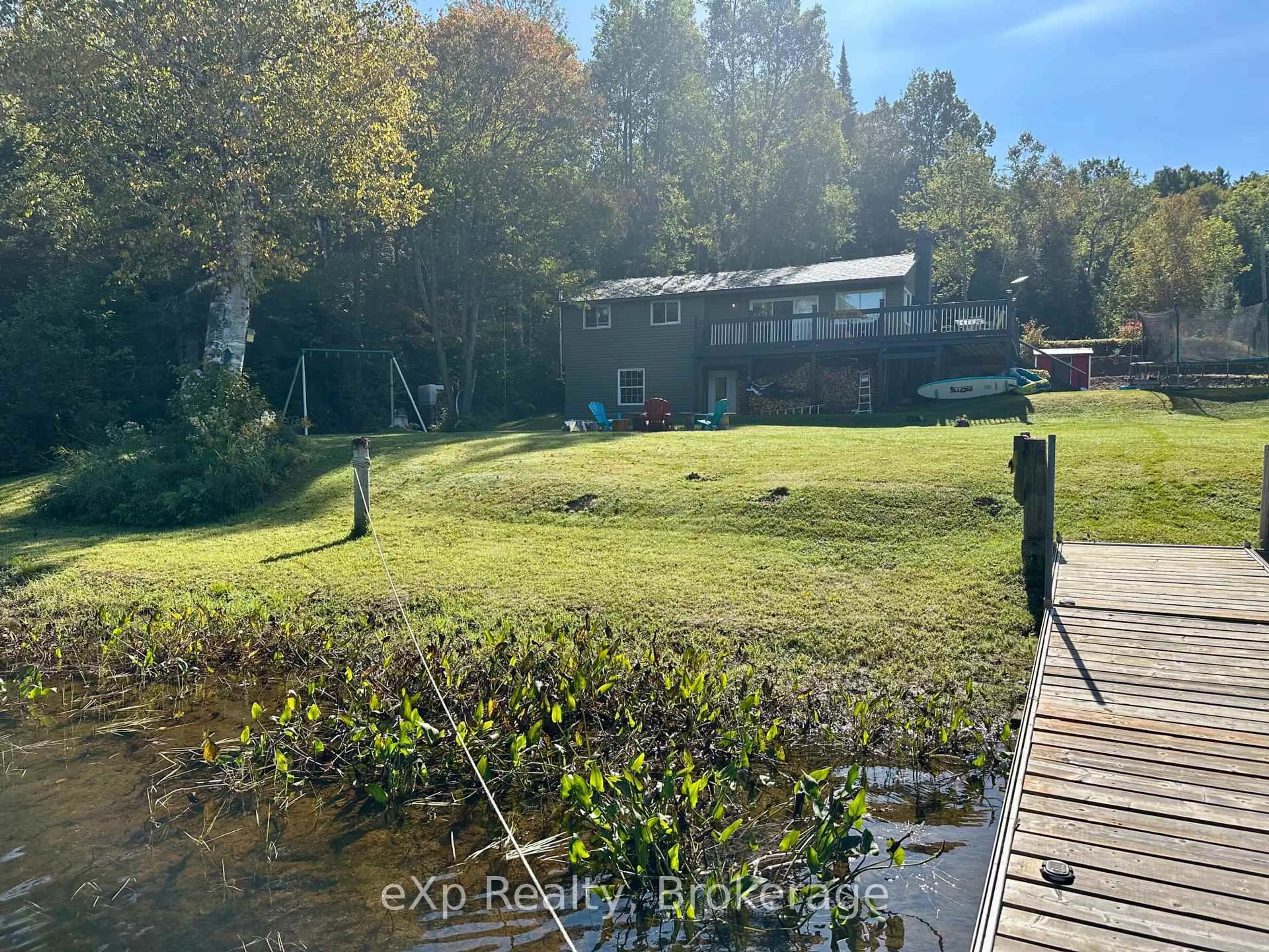 A pic from outside/outdoor area/front of a property/back of a property/a pic from drone, water/lake/river/ocean view for 249 River Dr, Burk's Falls Ontario P0A 1C0