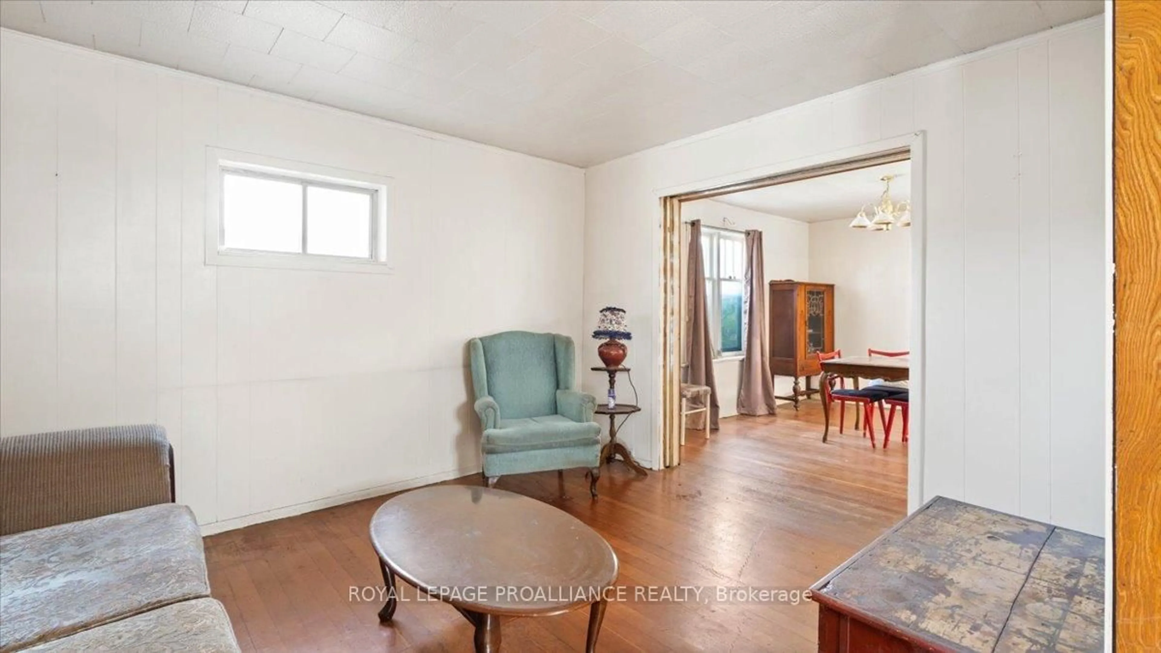Living room with furniture, wood/laminate floor for 51 1/2 North Front St, Belleville Ontario K8P 3B2