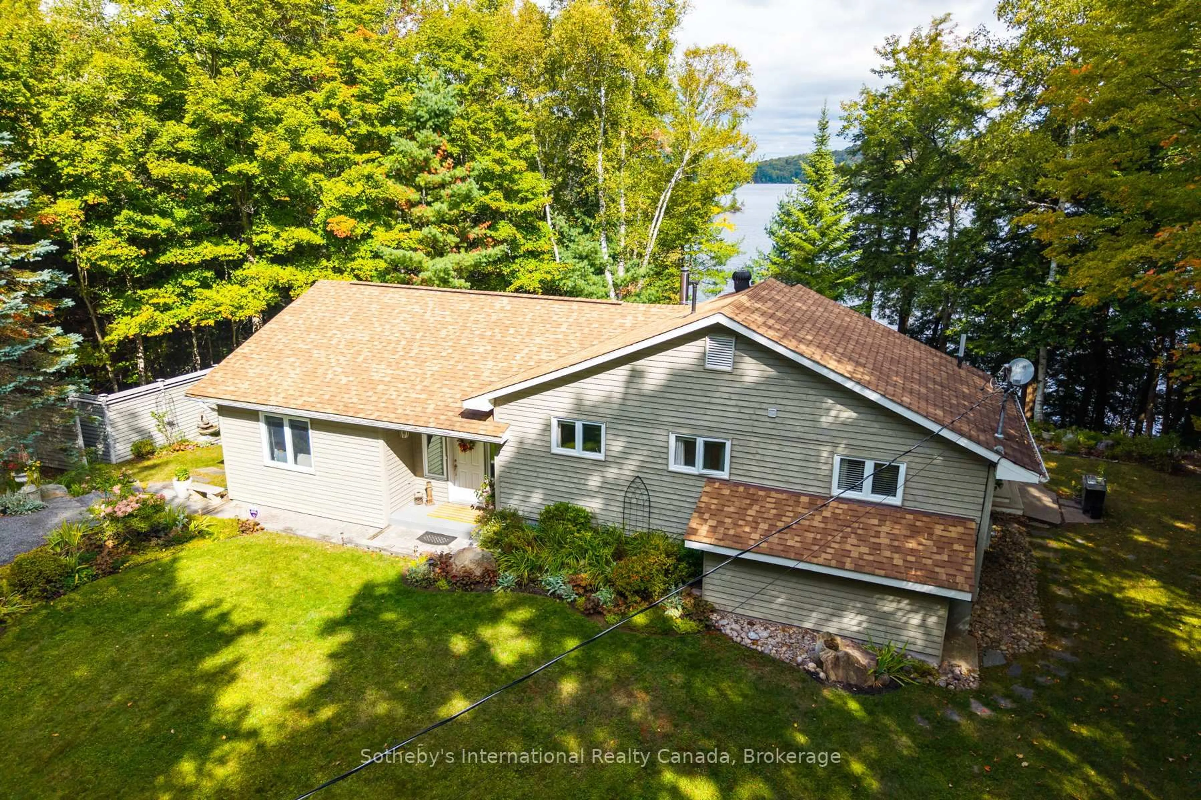 A pic from outside/outdoor area/front of a property/back of a property/a pic from drone, water/lake/river/ocean view for 20 Fish Rock Rd, Huntsville Ontario P1H 2N5