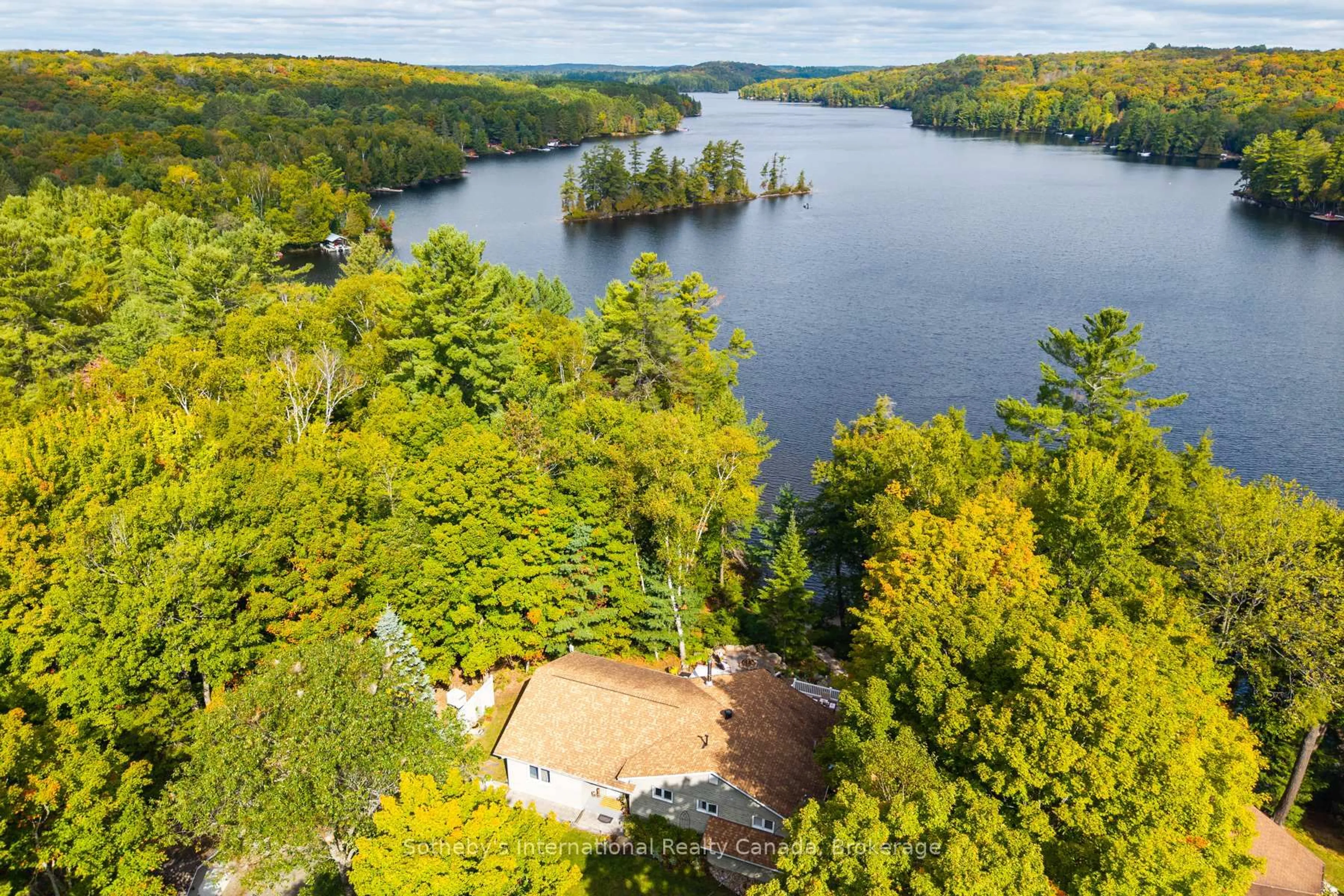 A pic from outside/outdoor area/front of a property/back of a property/a pic from drone, water/lake/river/ocean view for 20 Fish Rock Rd, Huntsville Ontario P1H 2N5