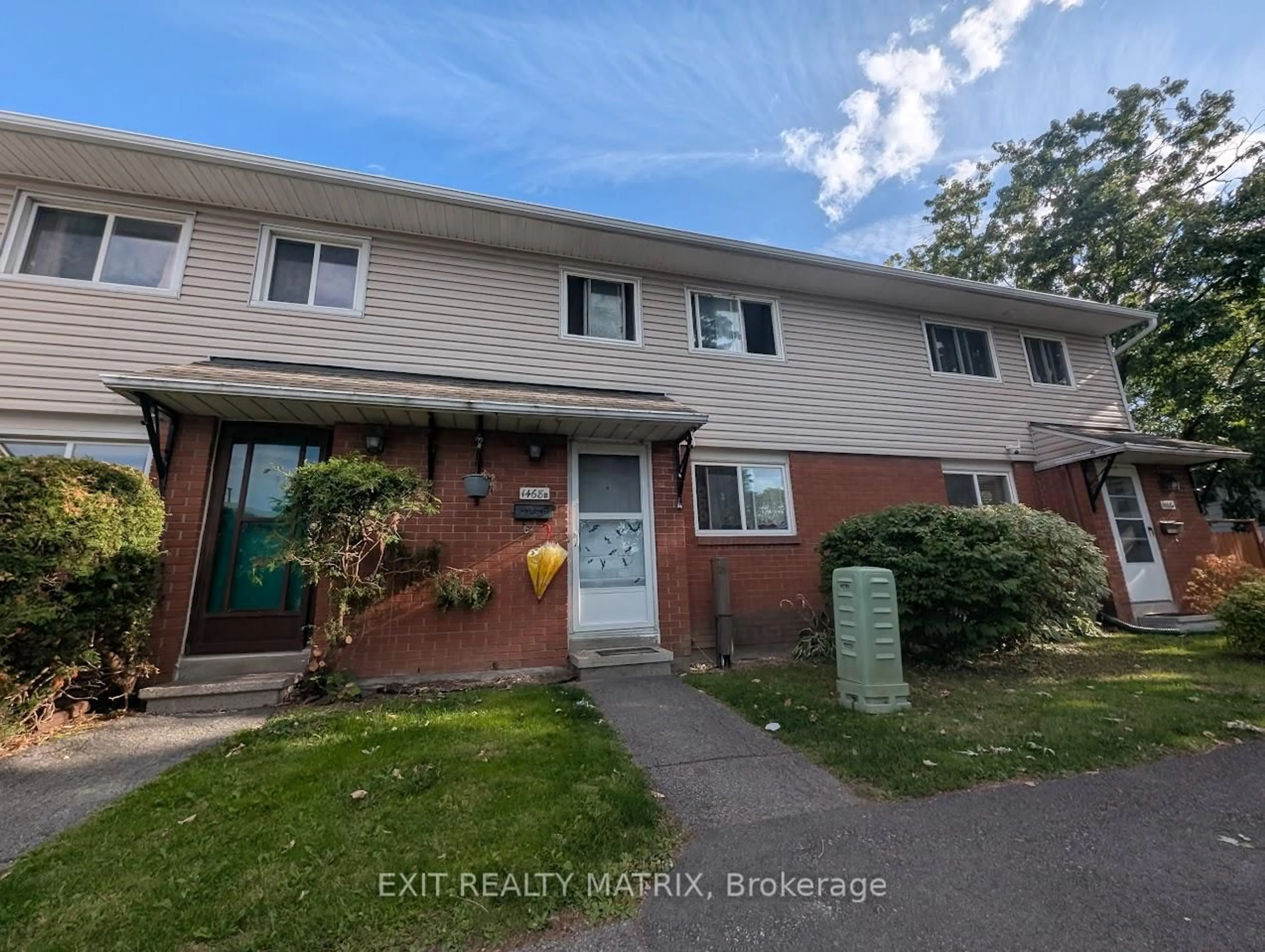 A pic from outside/outdoor area/front of a property/back of a property/a pic from drone, street for 1468 Heatherington Rd #B, Ottawa Ontario K1V 6S1