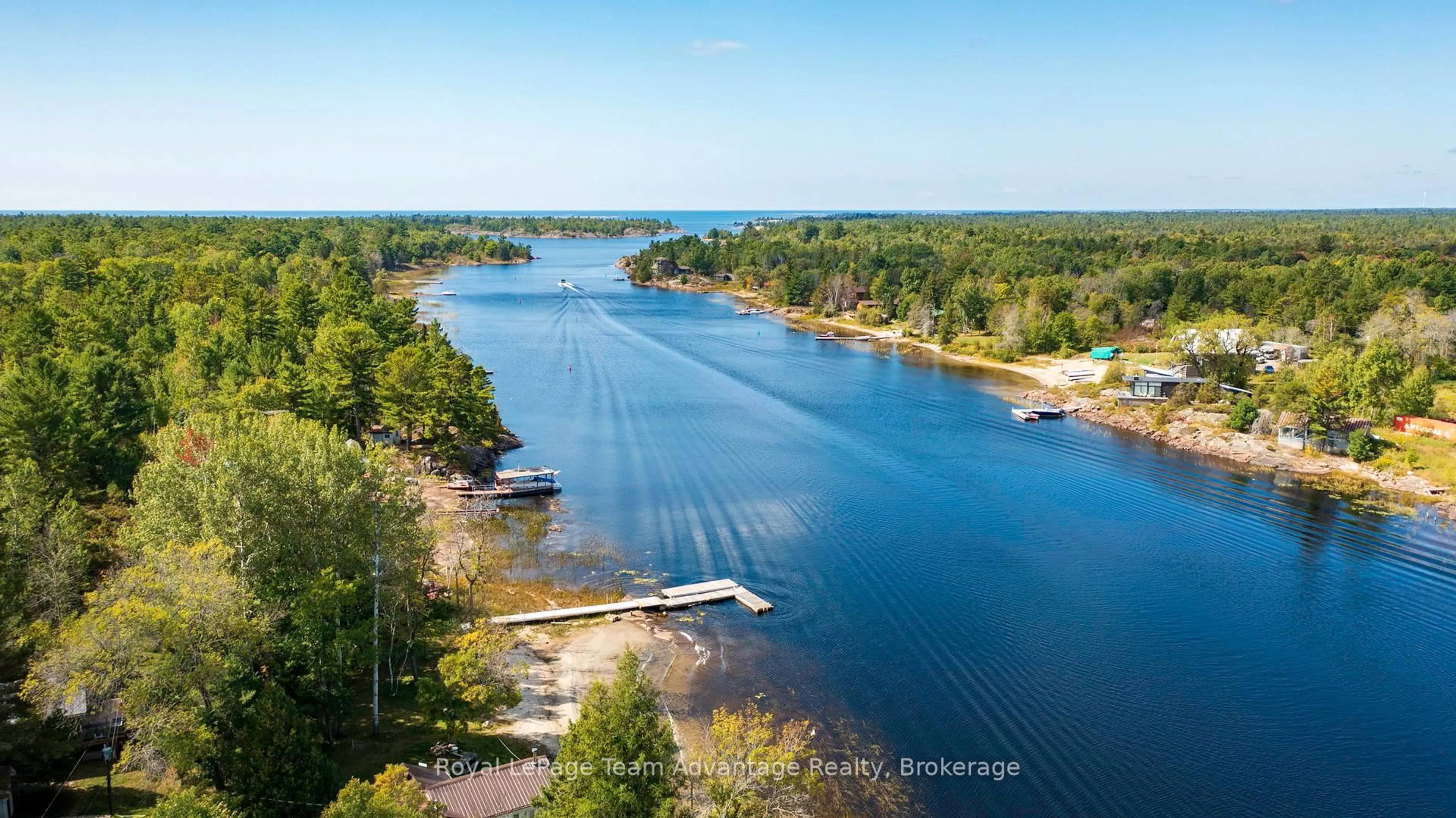 A pic from outside/outdoor area/front of a property/back of a property/a pic from drone, water/lake/river/ocean view for 2046 Riverside Dr, Parry Sound Remote Area Ontario P0G 1A0