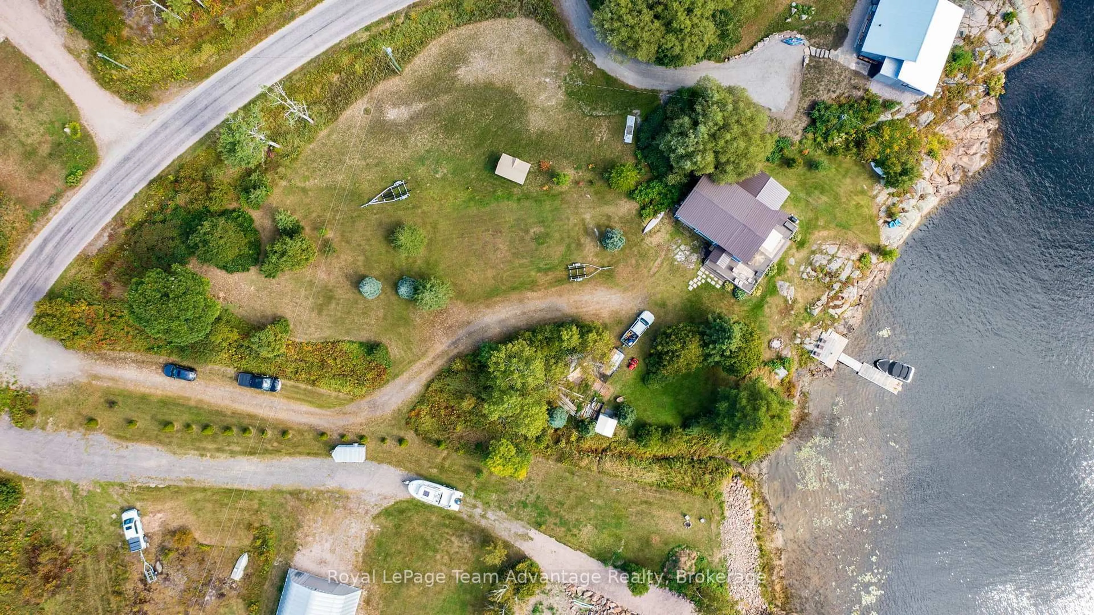 A pic from outside/outdoor area/front of a property/back of a property/a pic from drone, street for 2046 Riverside Dr, Parry Sound Remote Area Ontario P0G 1A0