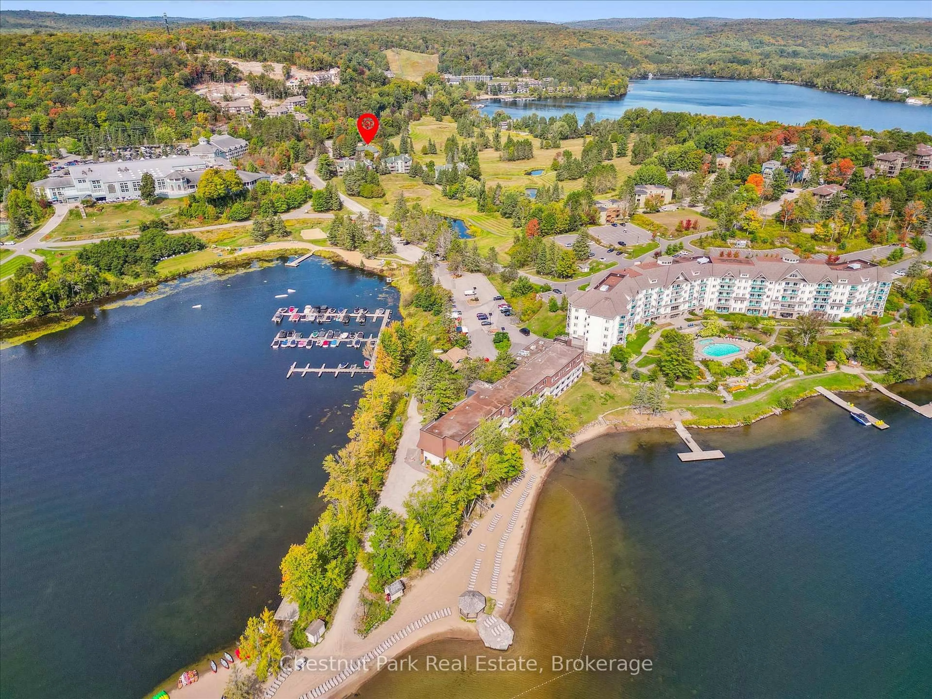 A pic from outside/outdoor area/front of a property/back of a property/a pic from drone, water/lake/river/ocean view for 1235 Deerhurst Dr #31-303, Huntsville Ontario P1H 2E8