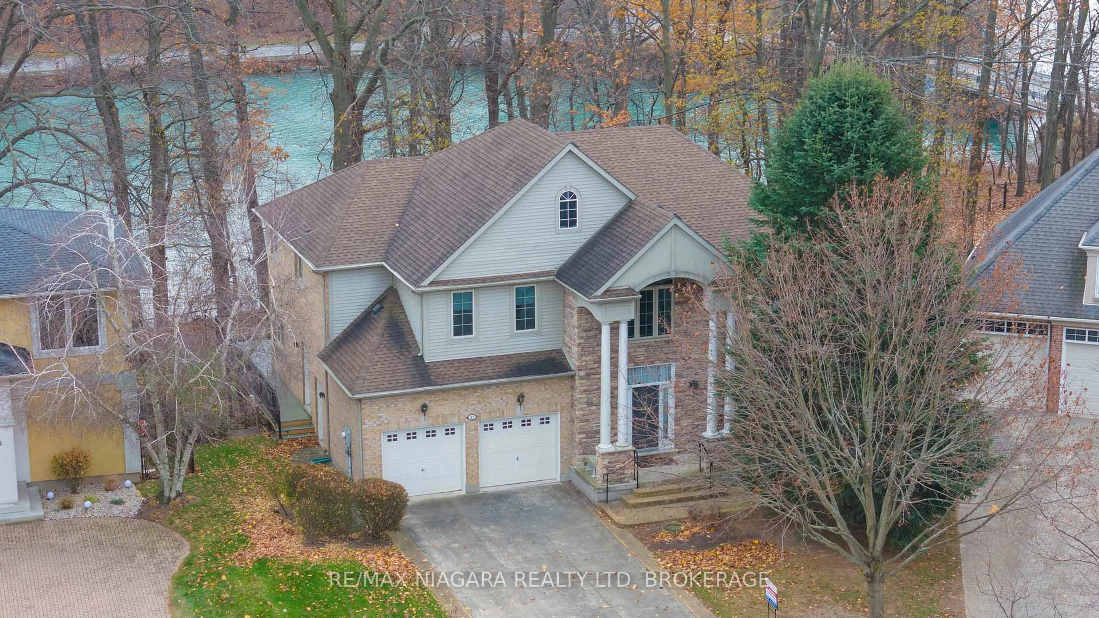 A pic from outside/outdoor area/front of a property/back of a property/a pic from drone, water/lake/river/ocean view for 47 Sculler's Way, St. Catharines Ontario L2N 7S9