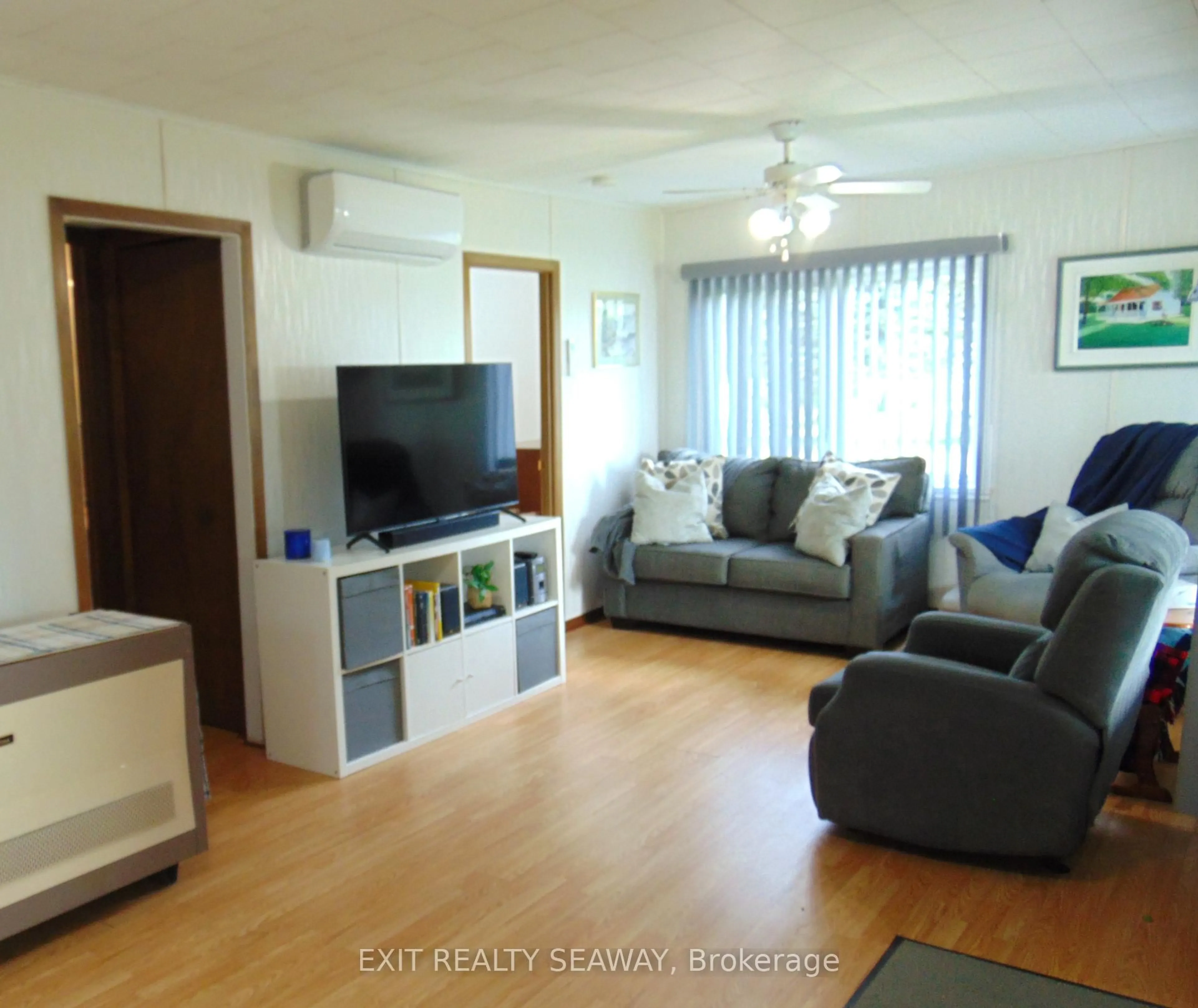 Living room with furniture, wood/laminate floor for 6242 Maple Ave, South Glengarry Ontario K0C 1N0