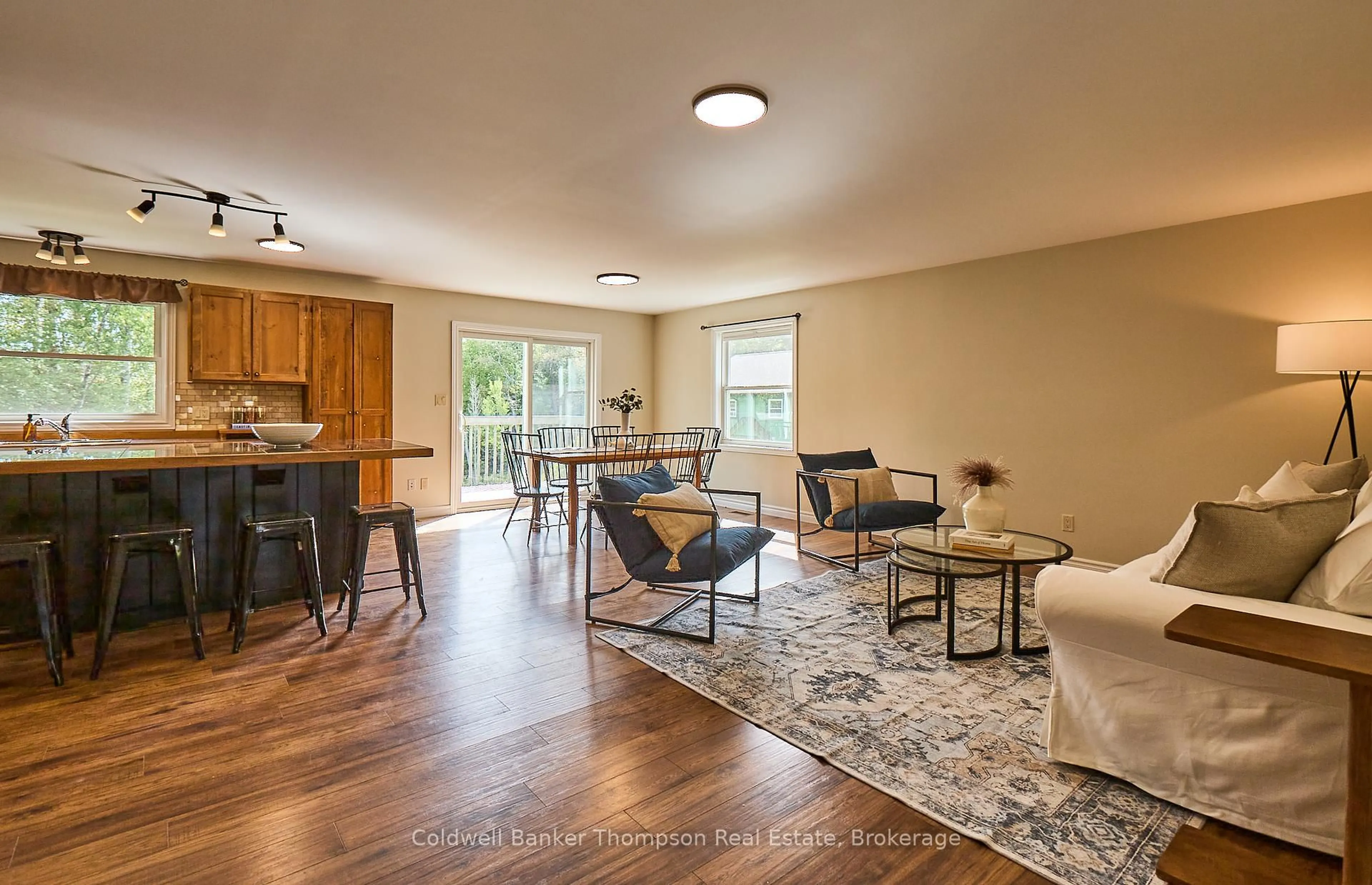 Living room with furniture, wood/laminate floor for 215 Town Line Rd, Huntsville Ontario P1H 1S7
