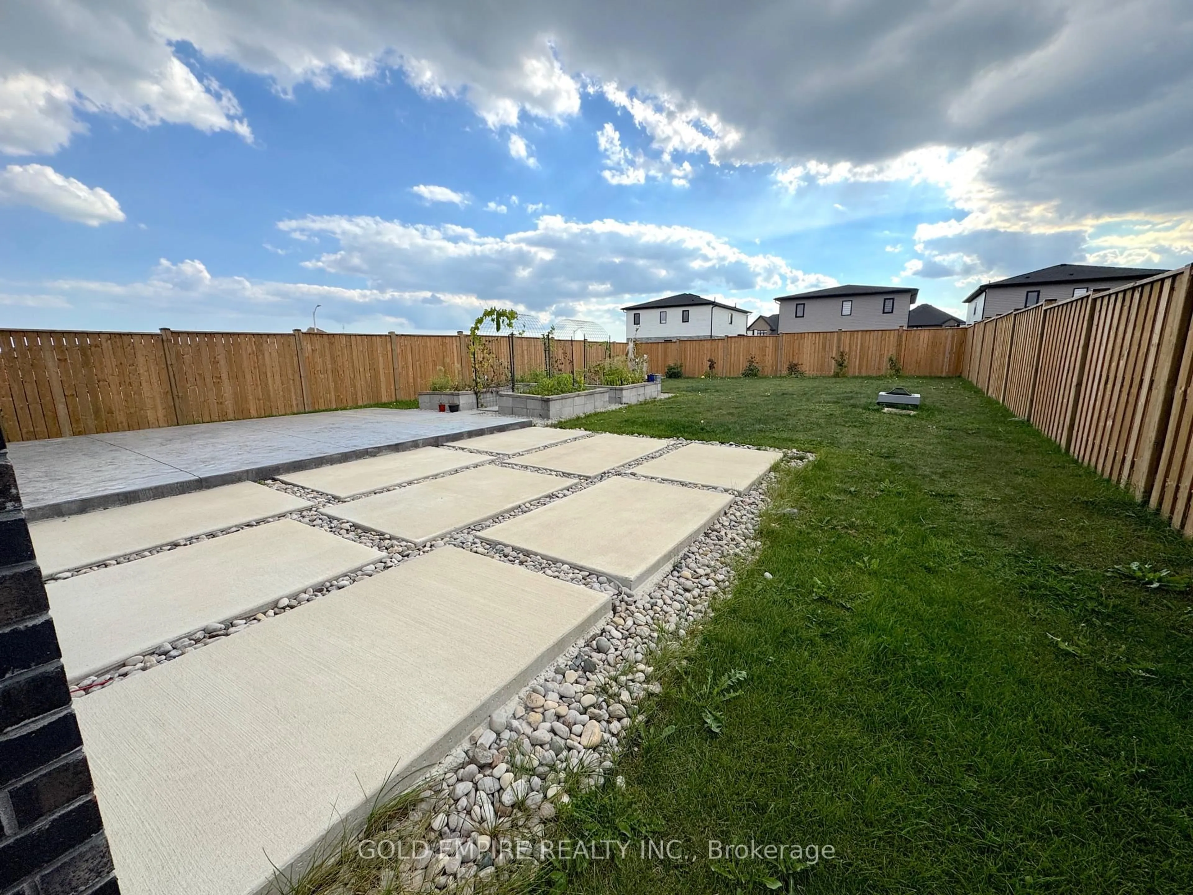 A pic from outside/outdoor area/front of a property/back of a property/a pic from drone, street for 61 Poole Cres, Middlesex Centre Ontario N0L 1R0