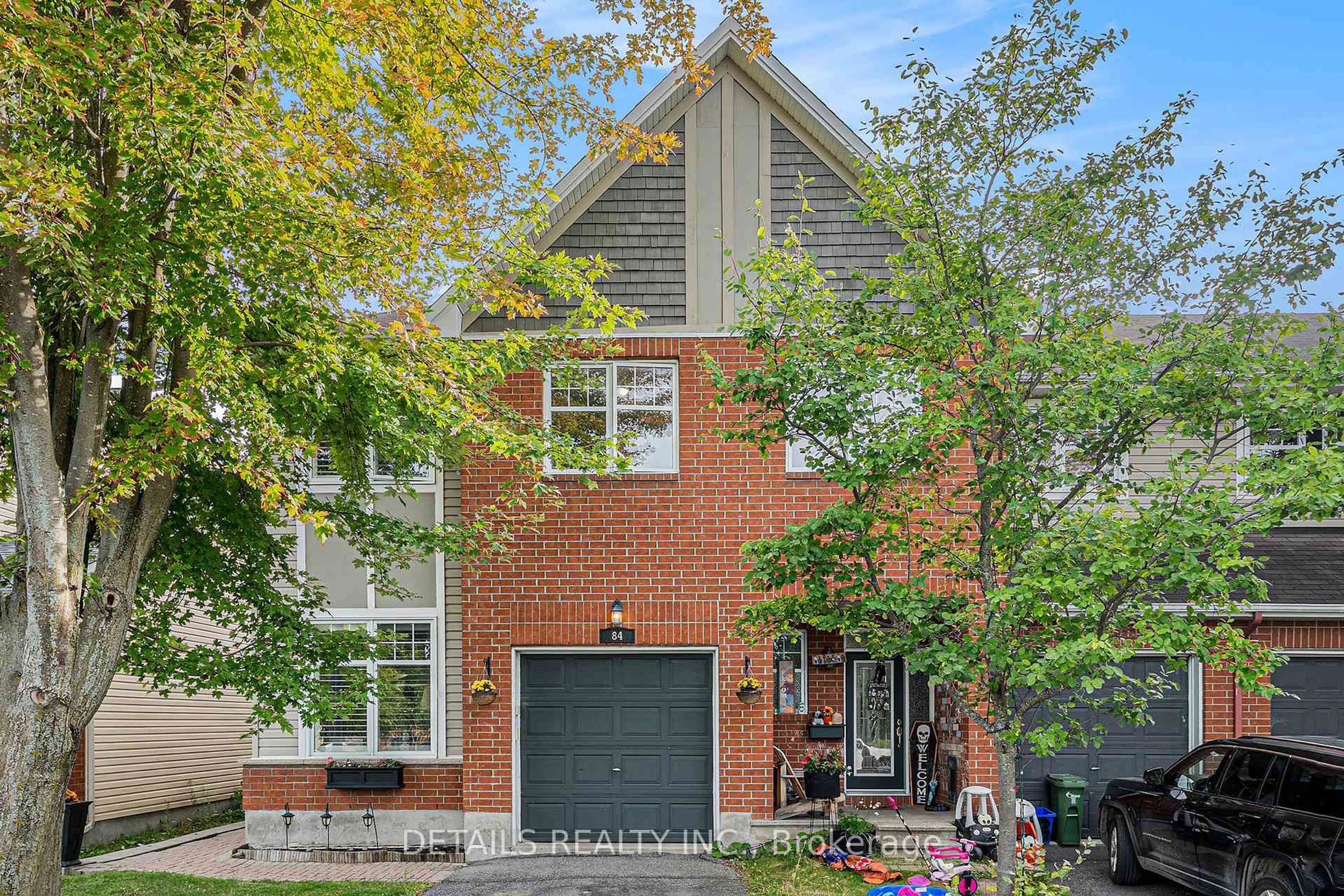 Home with brick exterior material, street for 84 Waterbridge Dr, Ottawa Ontario K2G 6T3