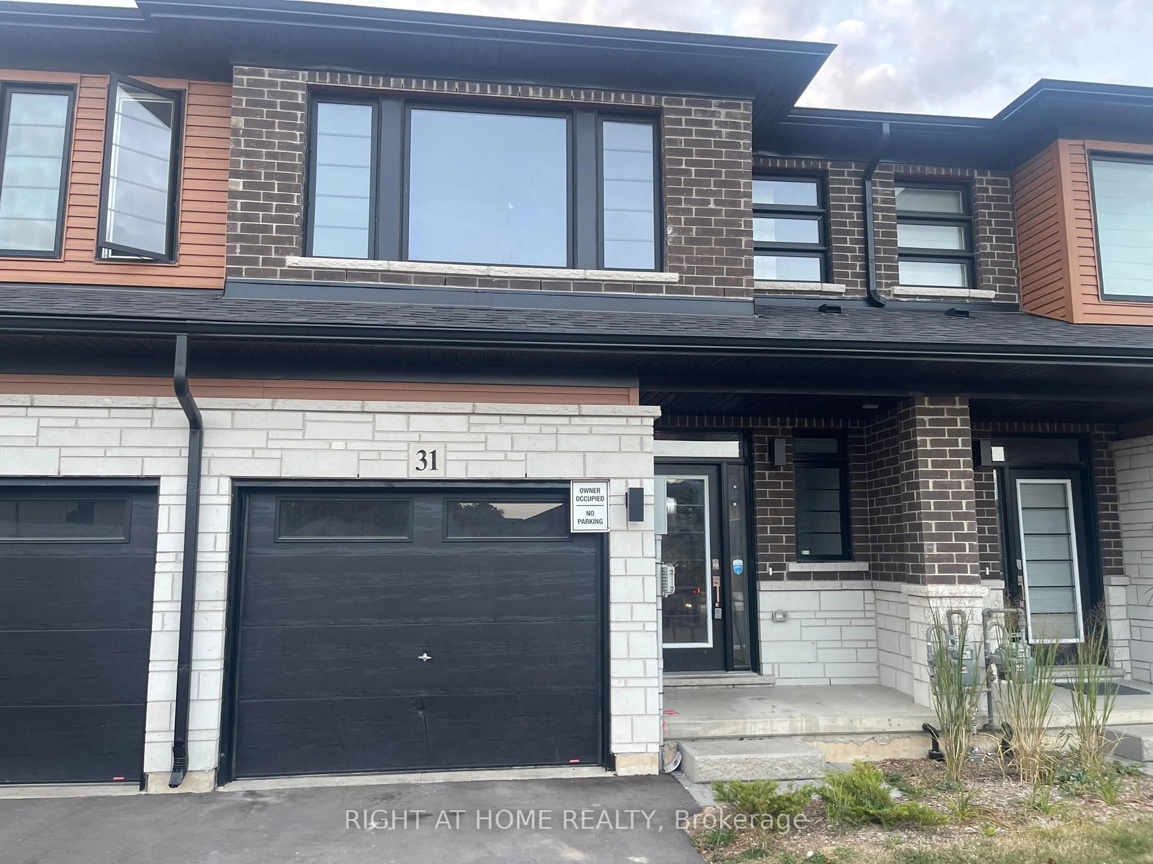 Home with brick exterior material, street for 448 Blackburn Dr #31, Brantford Ontario N3T 0X2